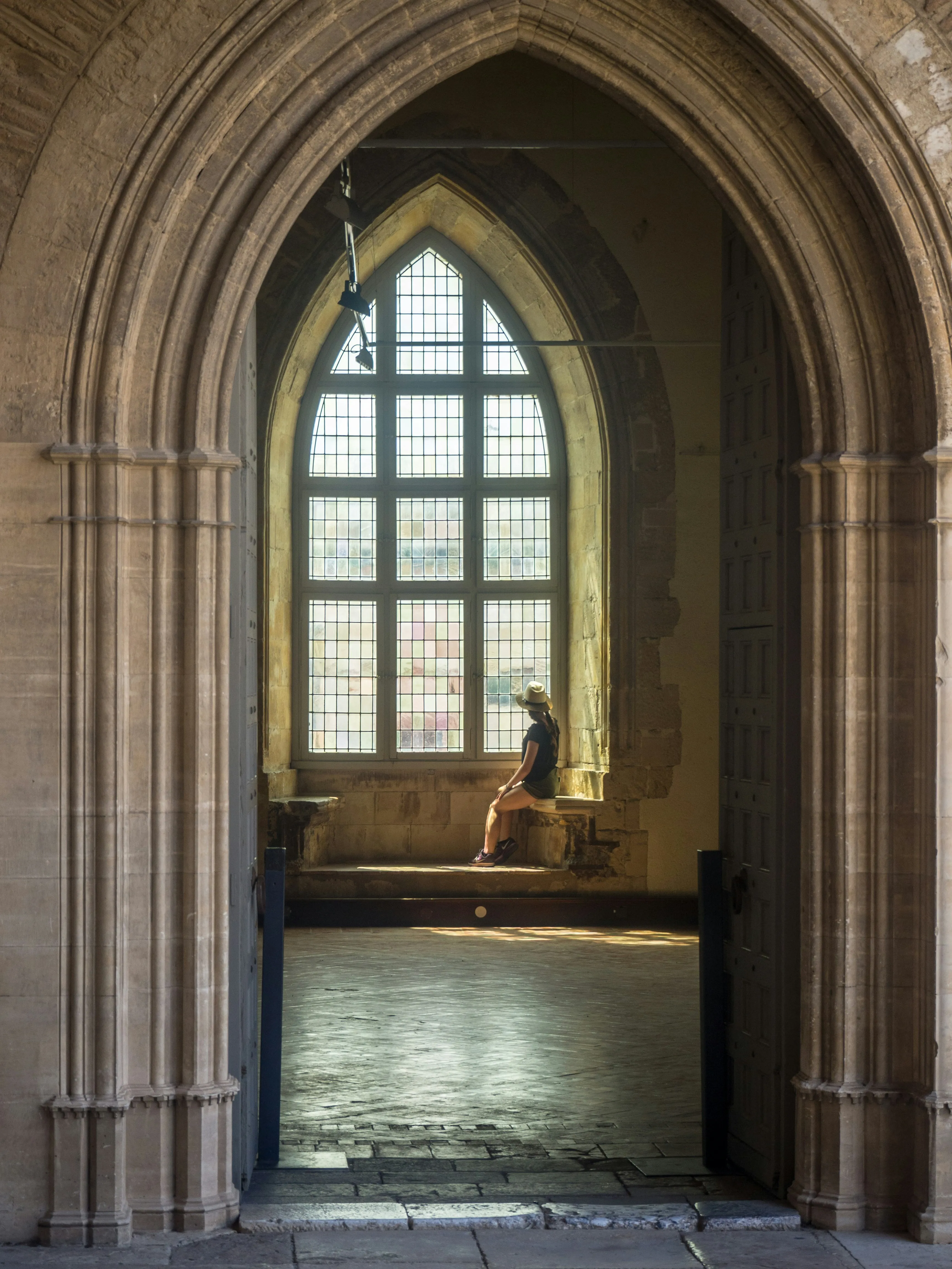 Peaceful Sunlight Entering Ancient Church Hall Wallpaper