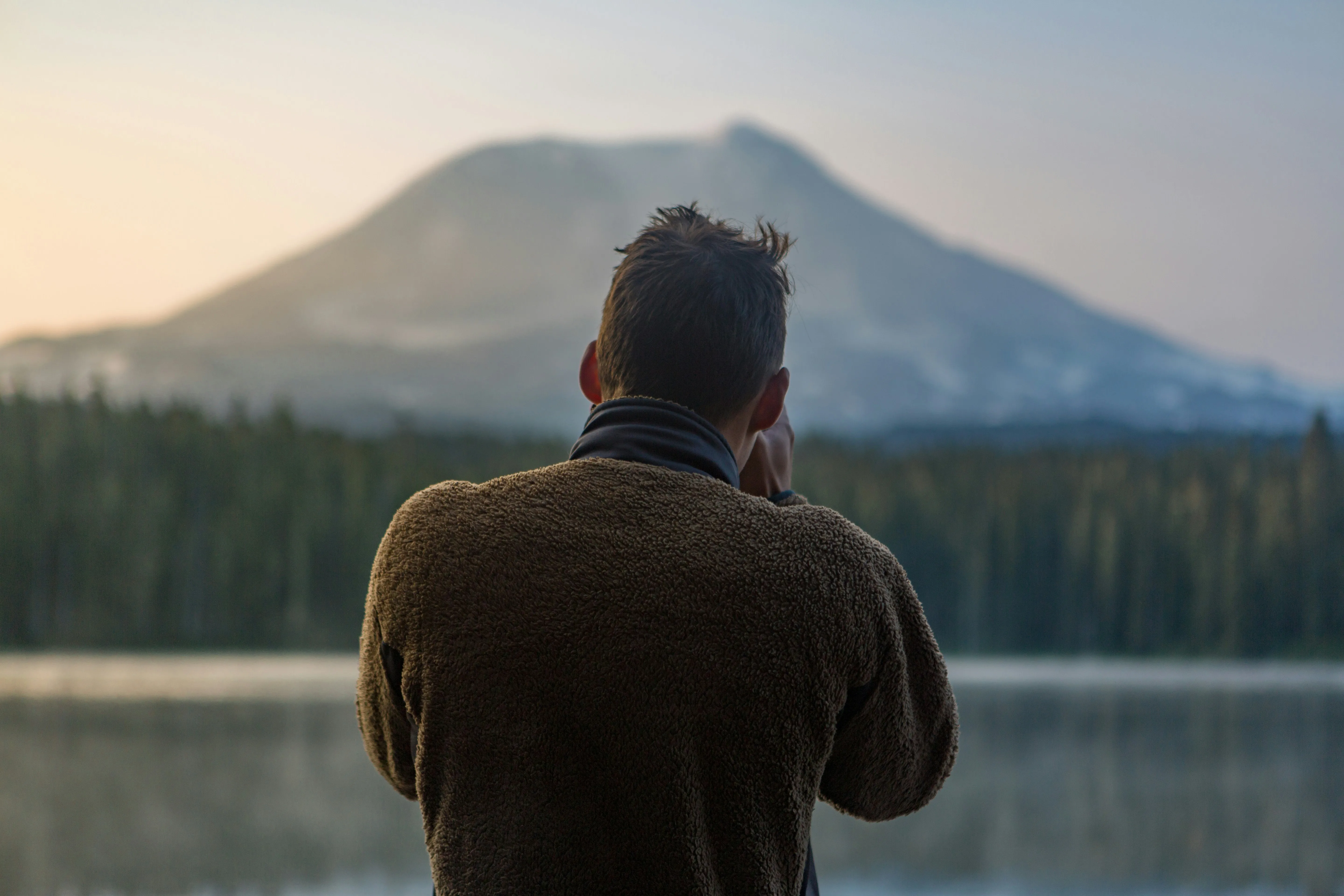 Person Watching Mountain View During Peaceful Dawn