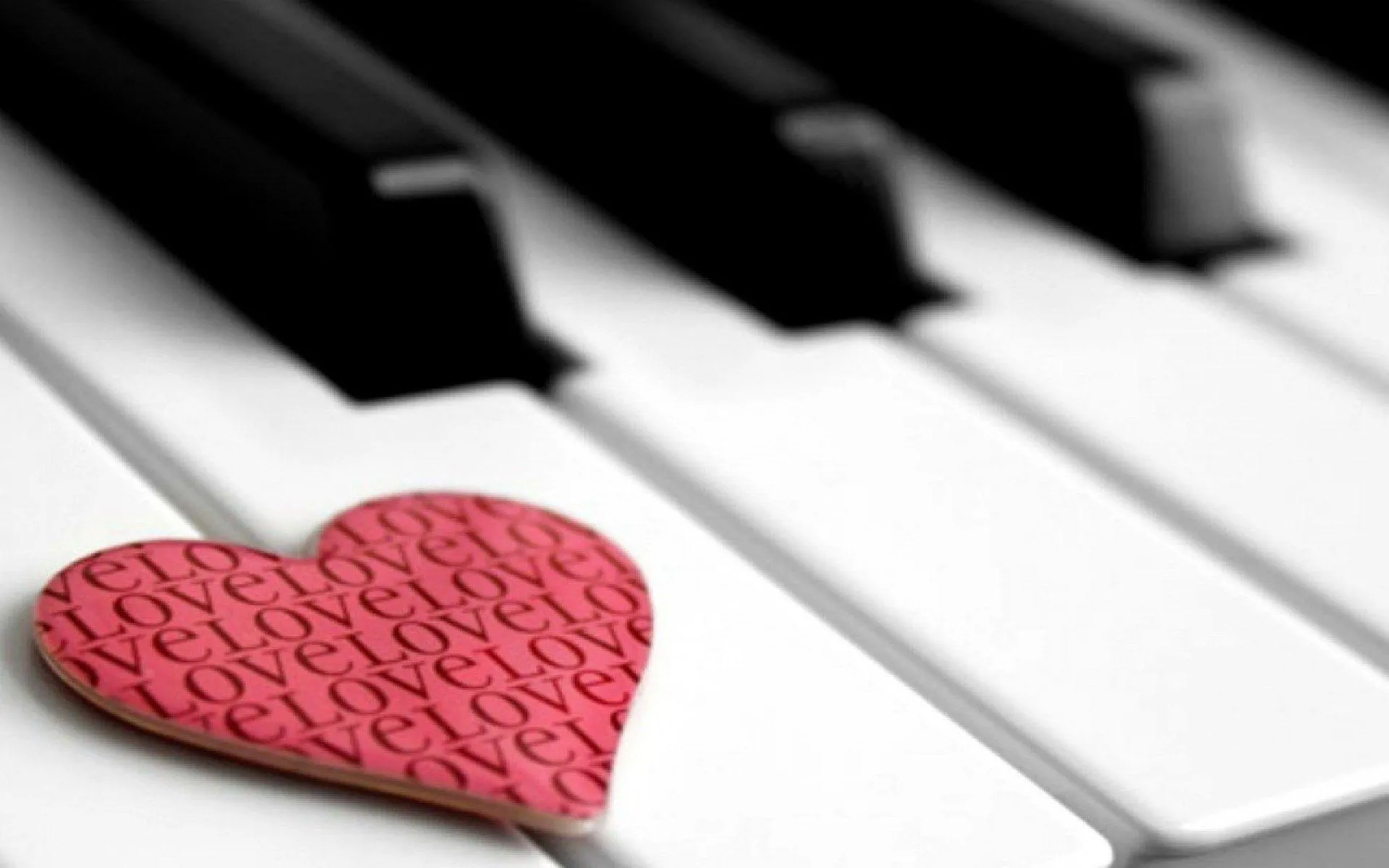 Piano Keys and Red Heart Depicting Musical Love Wallpaper