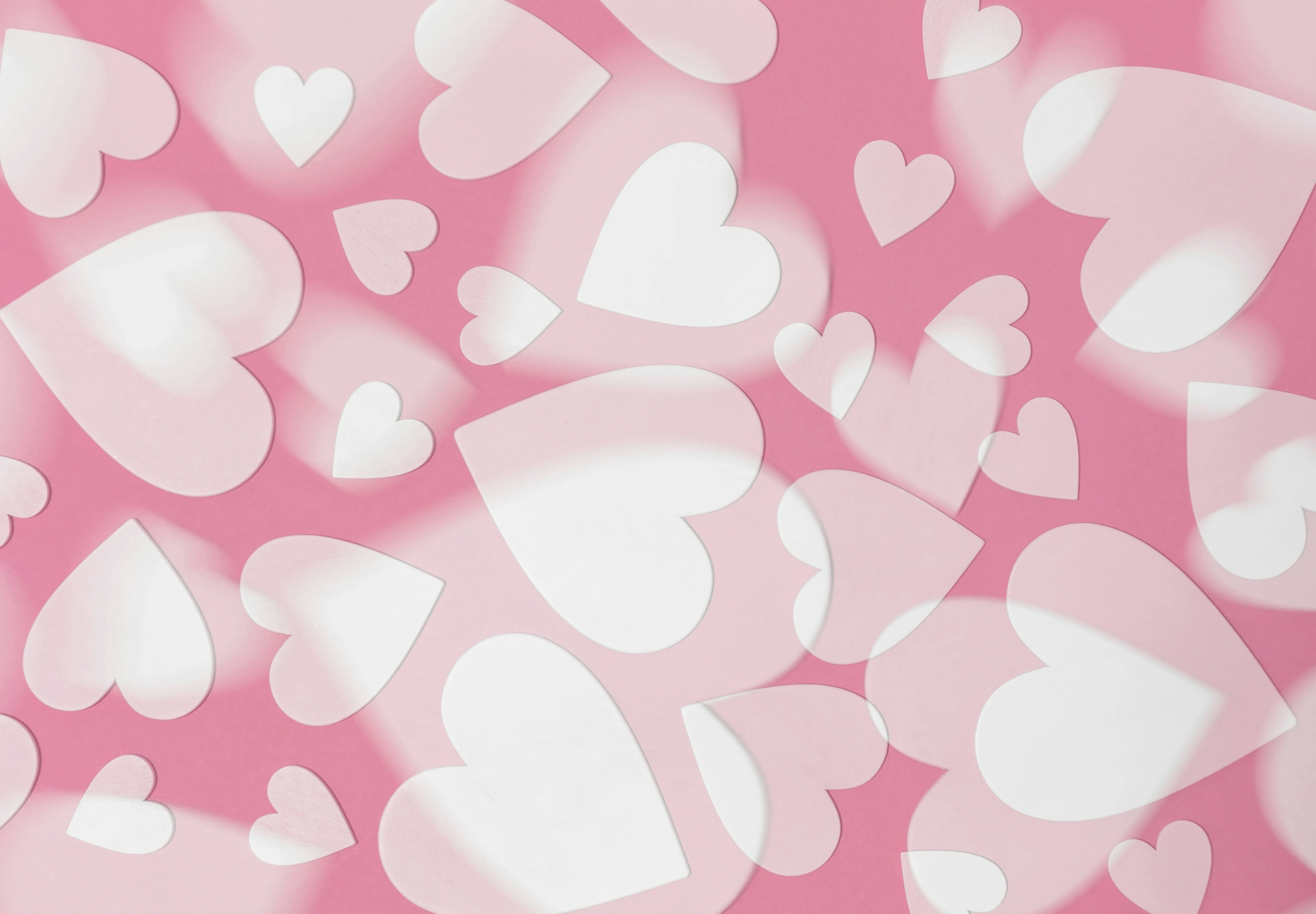 Pink and White Hearts Pattern Spreading Joy Wallpaper