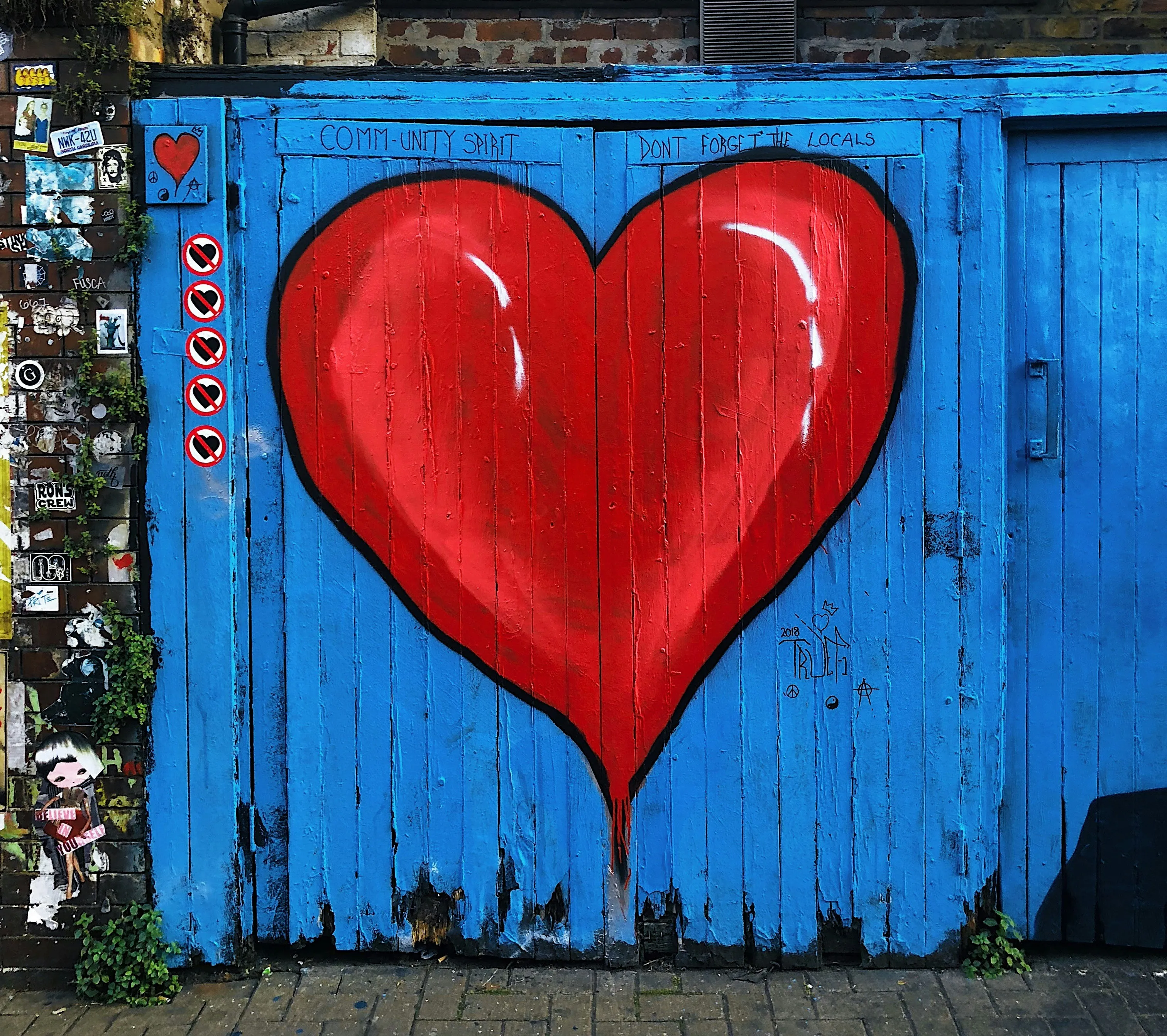 Red Heart Painted on Blue Wooden Background Wallpaper