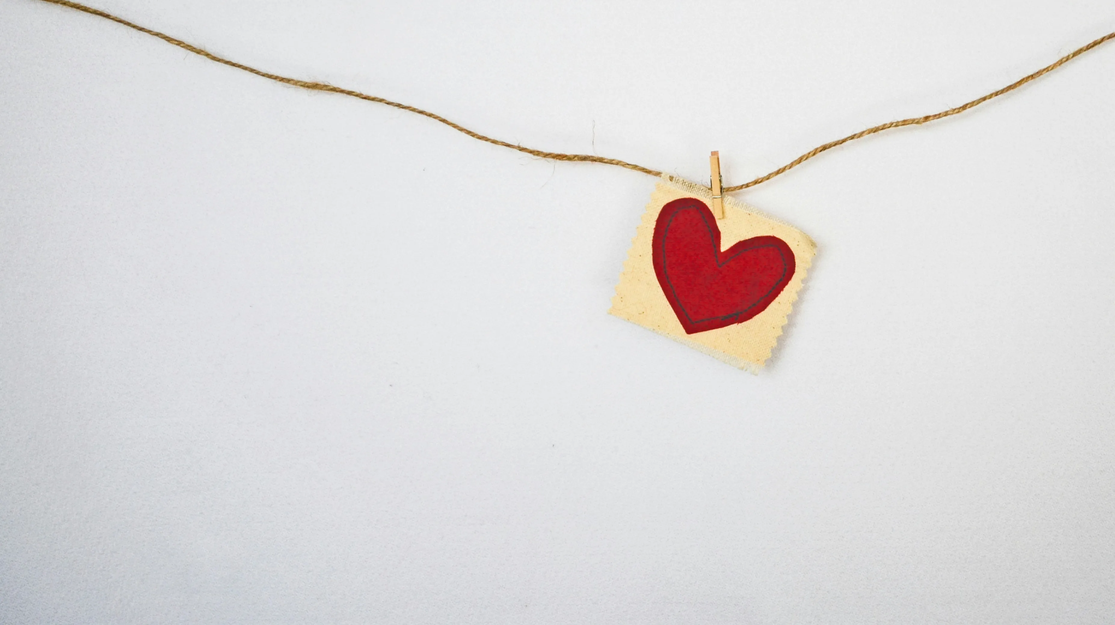 Red Heart Pendant Representing Deep Feeling Wallpaper