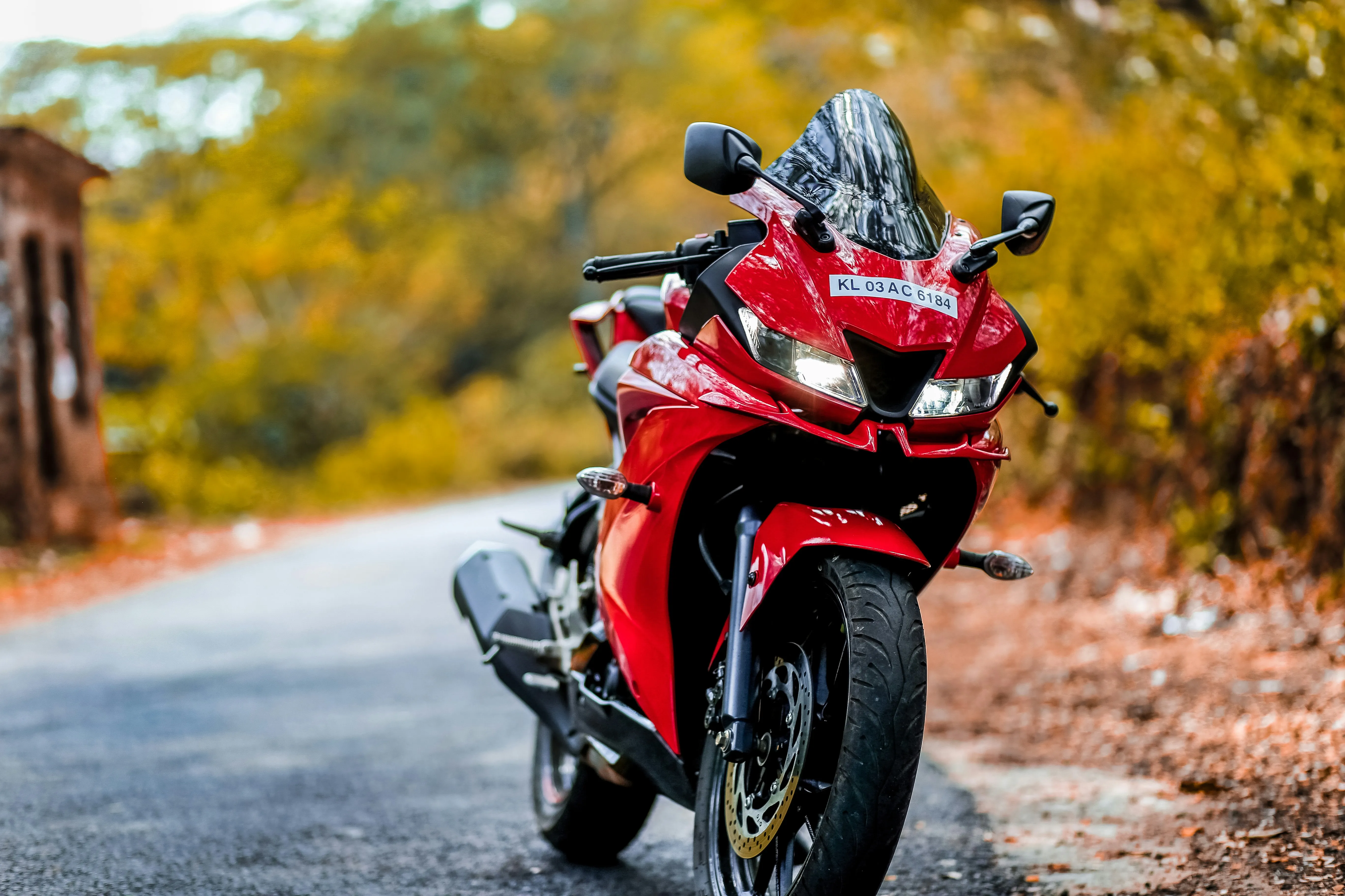 Red Motorcycle Journey Showing Passion and Freedom Wallpaper
