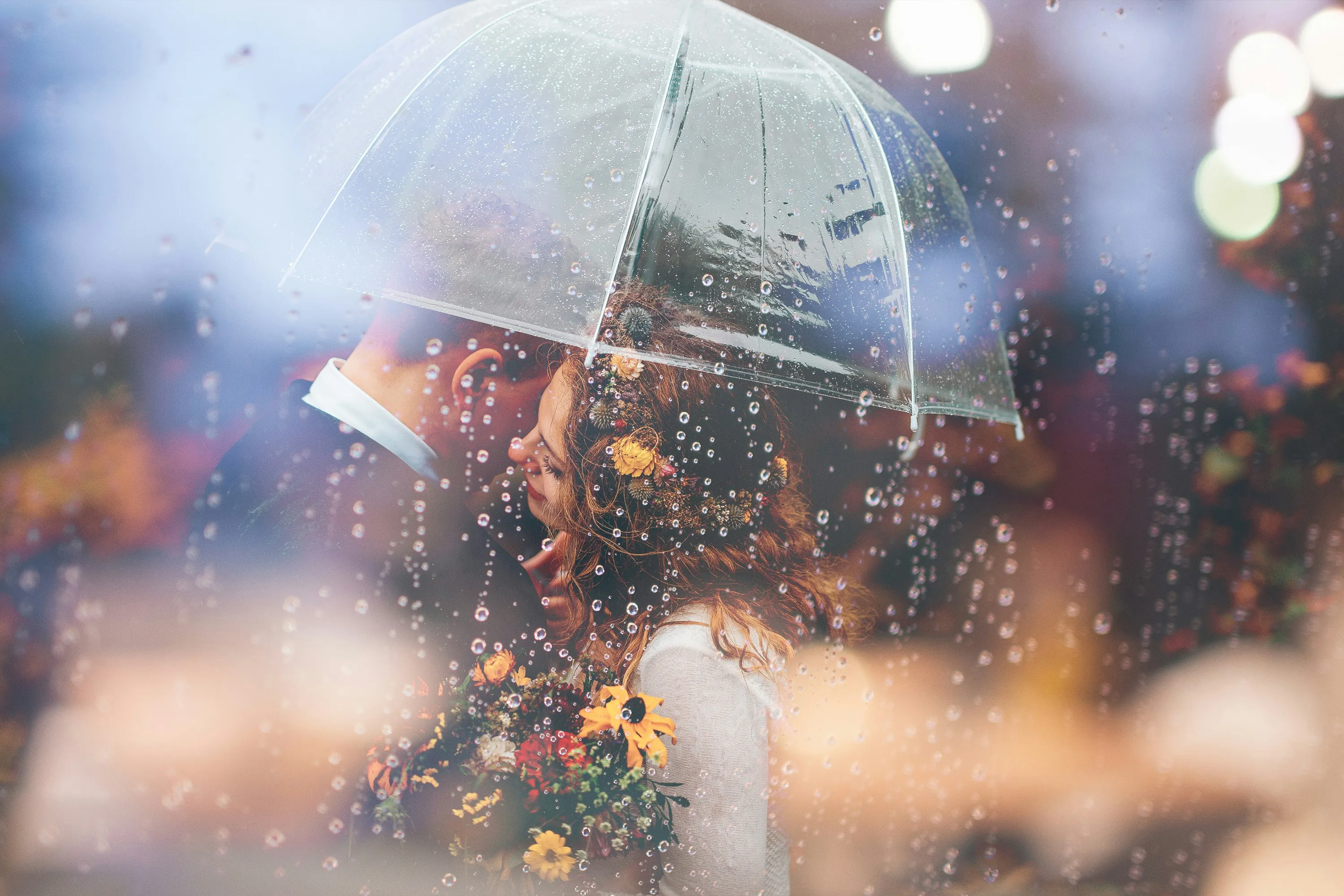 Romantic Couple Embraces Under Umbrella in Gentle Rain