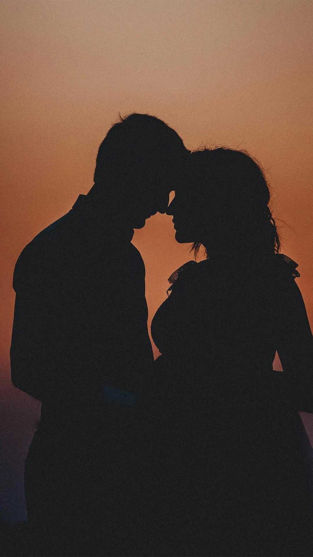 Romantic Couple in Shadow Sharing Tender Hug Wallpaper