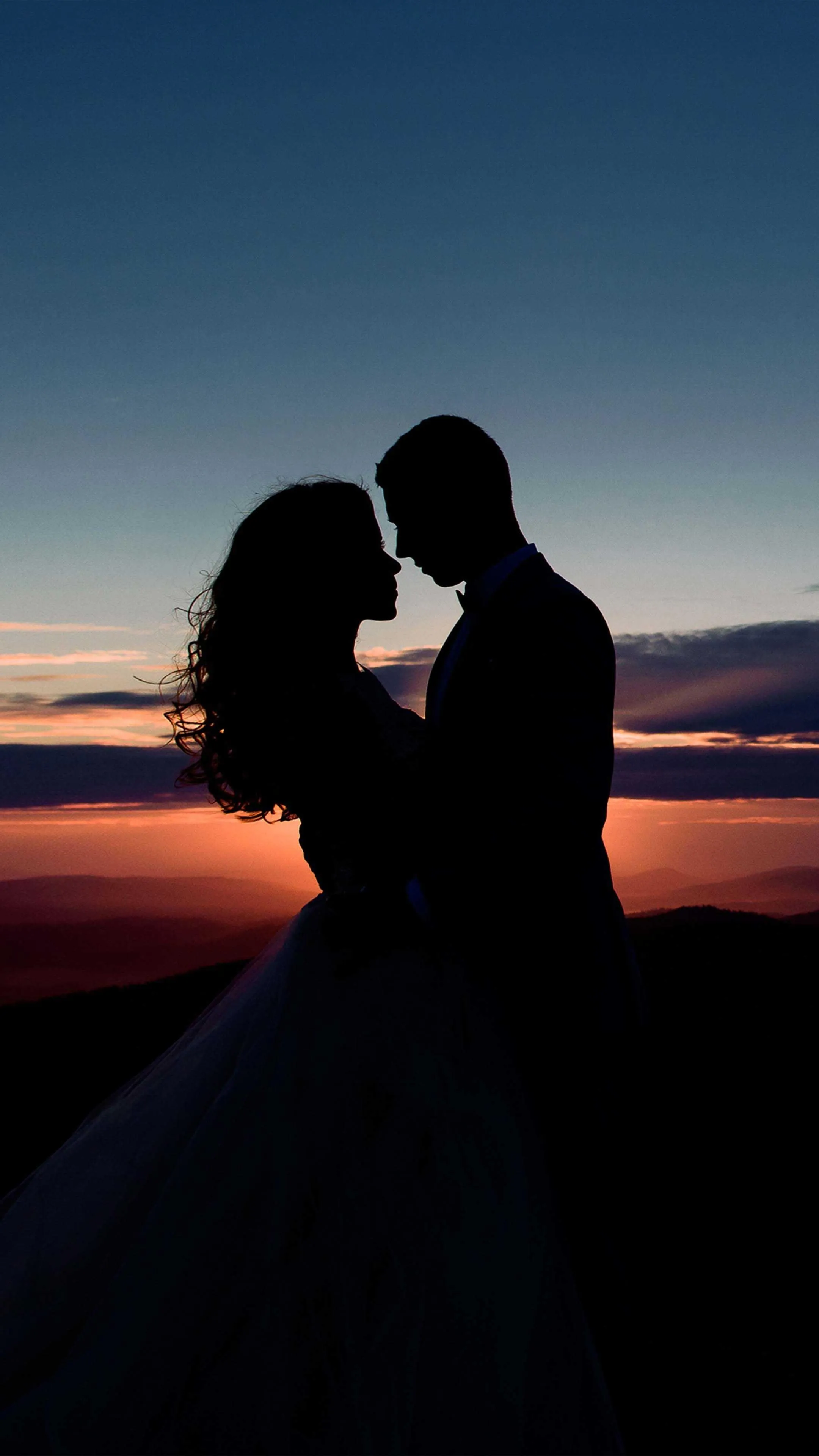 Romantic Couple Silhouette Against Peaceful Sunset