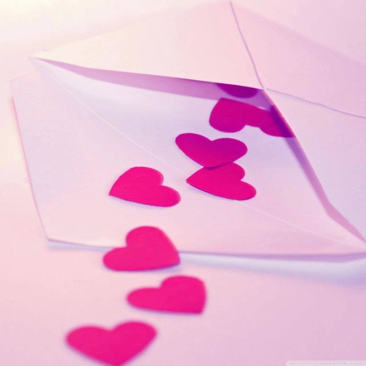 Romantic Love Letter with Pink Paper Hearts Inside Wallpaper