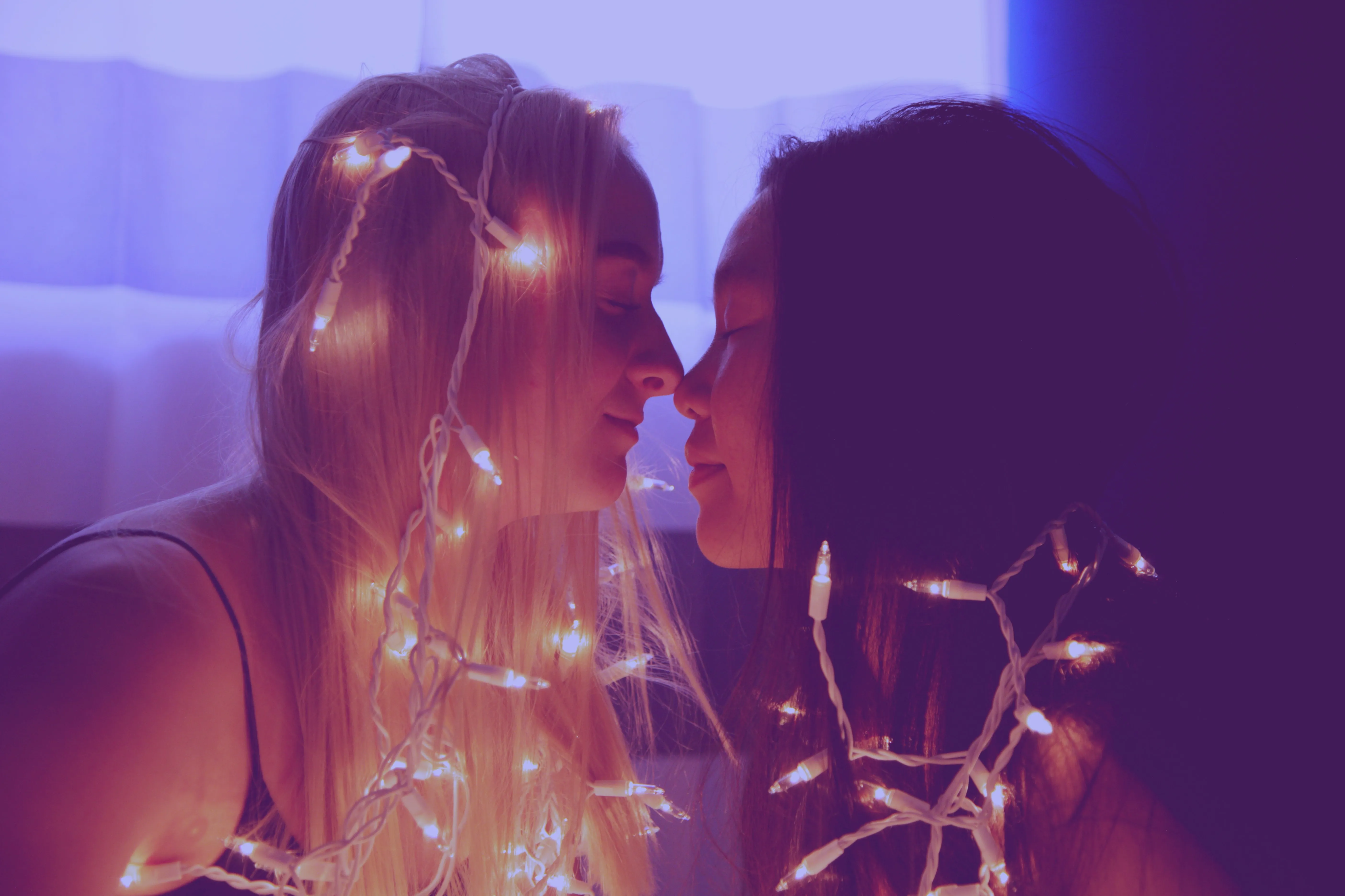 Romantic Moment with Fairy Lights and Soft Glow Wallpaper