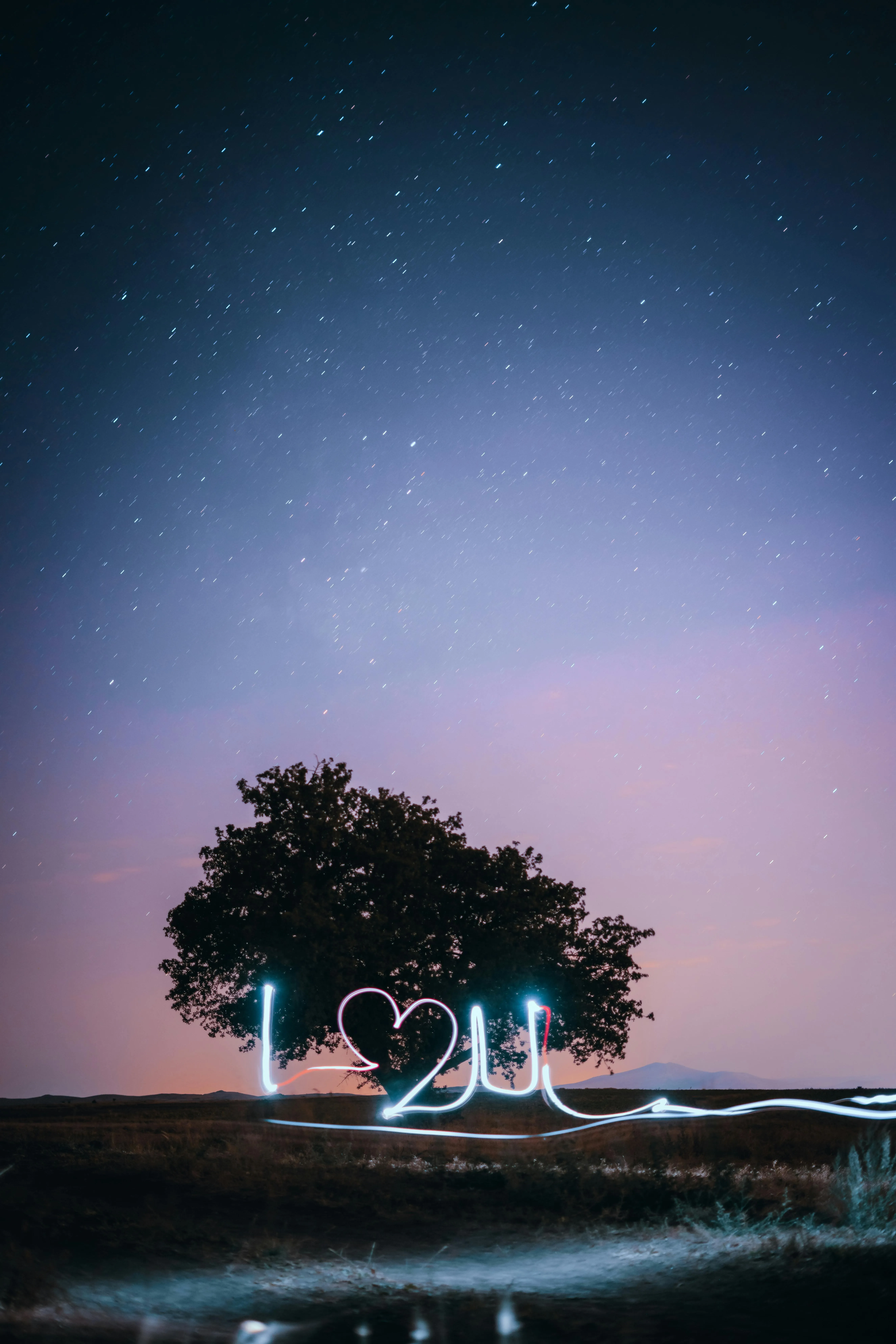 Romantic Night Sky with Glowing Love Message Wallpaper