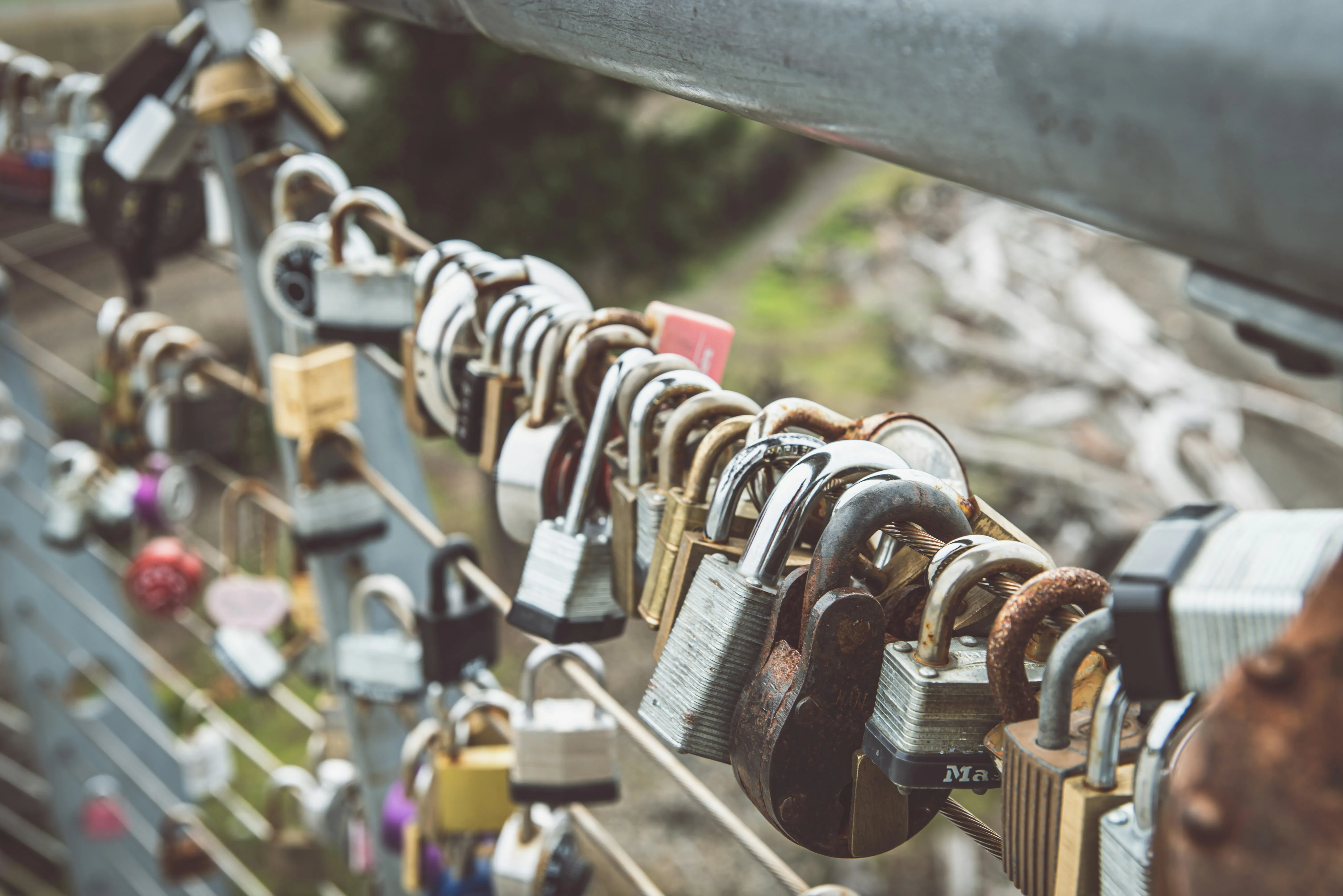 Row of Padlocks on Bridge Symbolizing True Love Wallpaper
