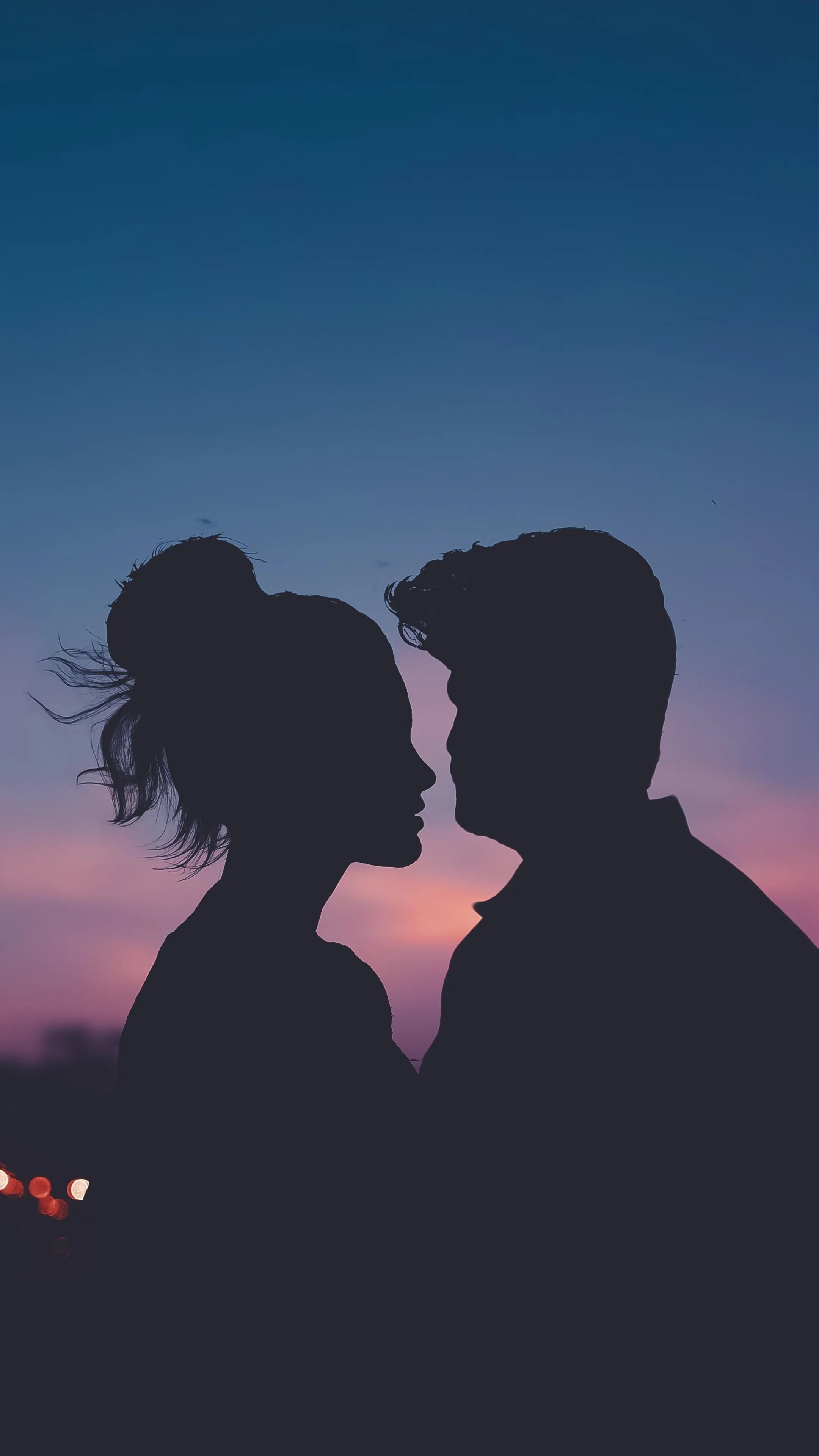 Silhouette Lovers Gazing at Each Other Deeply Wallpaper