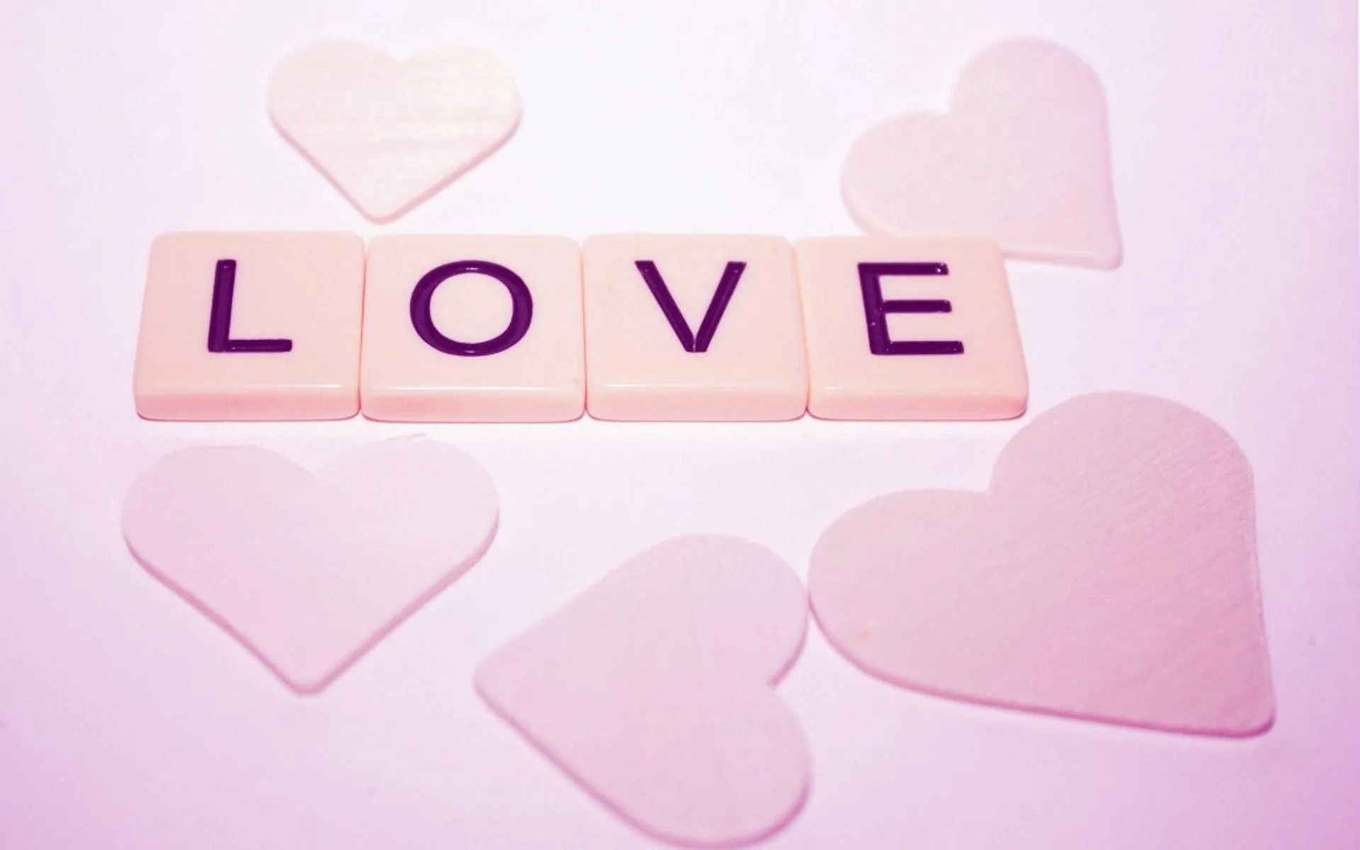 Soft Pink Letters Spelling the Word of Love Wallpaper