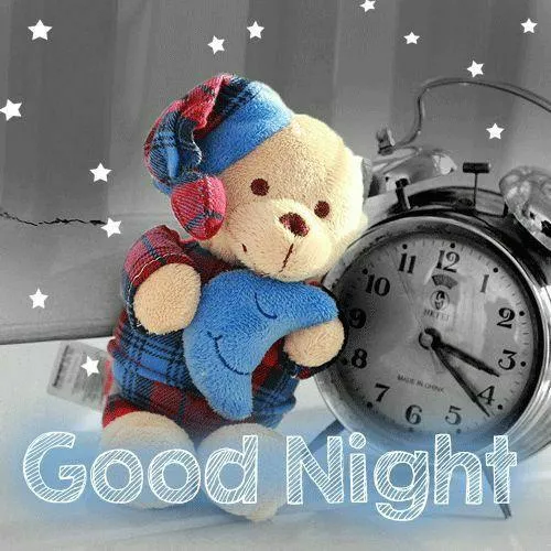 Soft Teddy Bear on Bed Saying Good Night to All Wallpaper