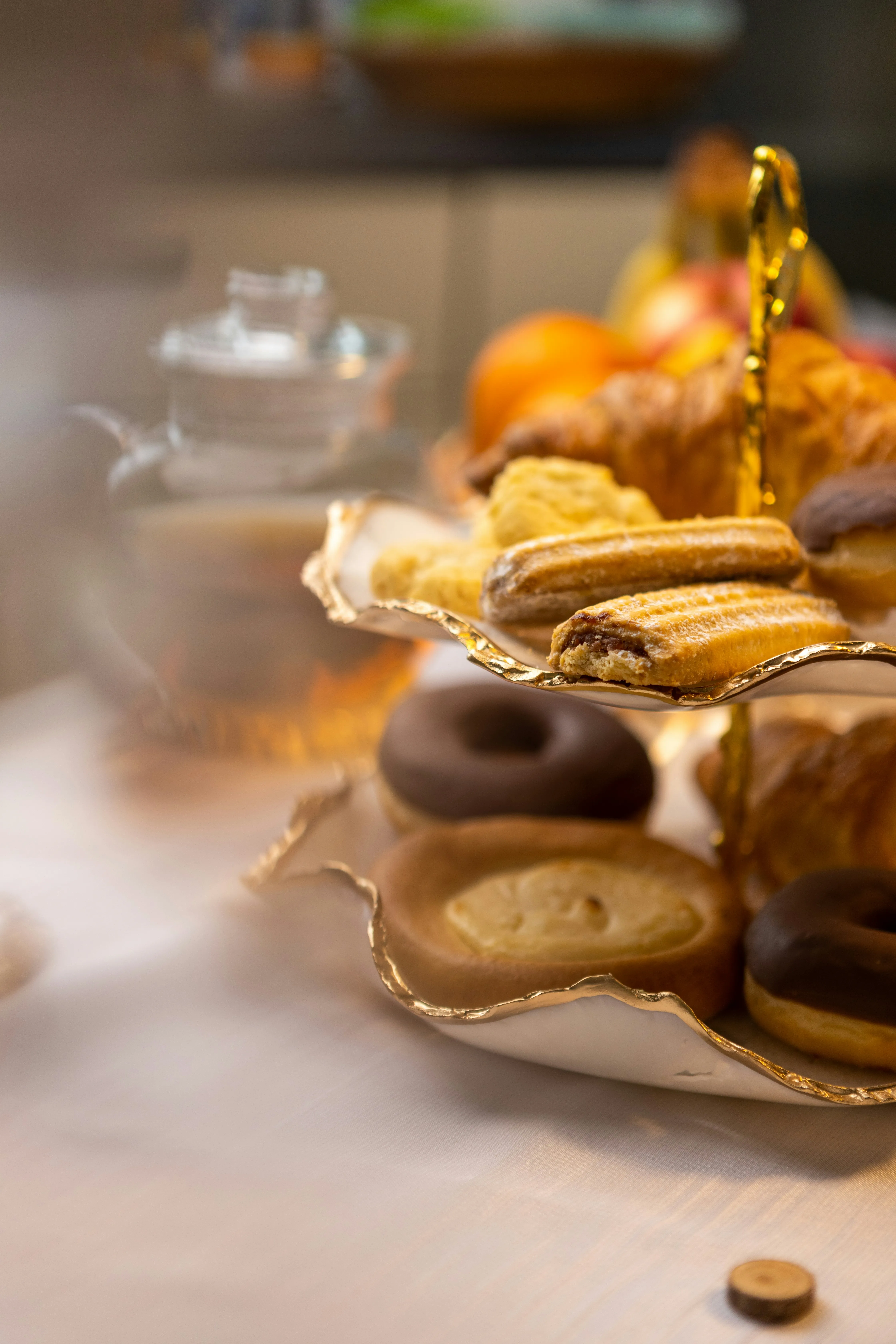 Stack of Donuts and Coffee on Breakfast Table Wallpaper