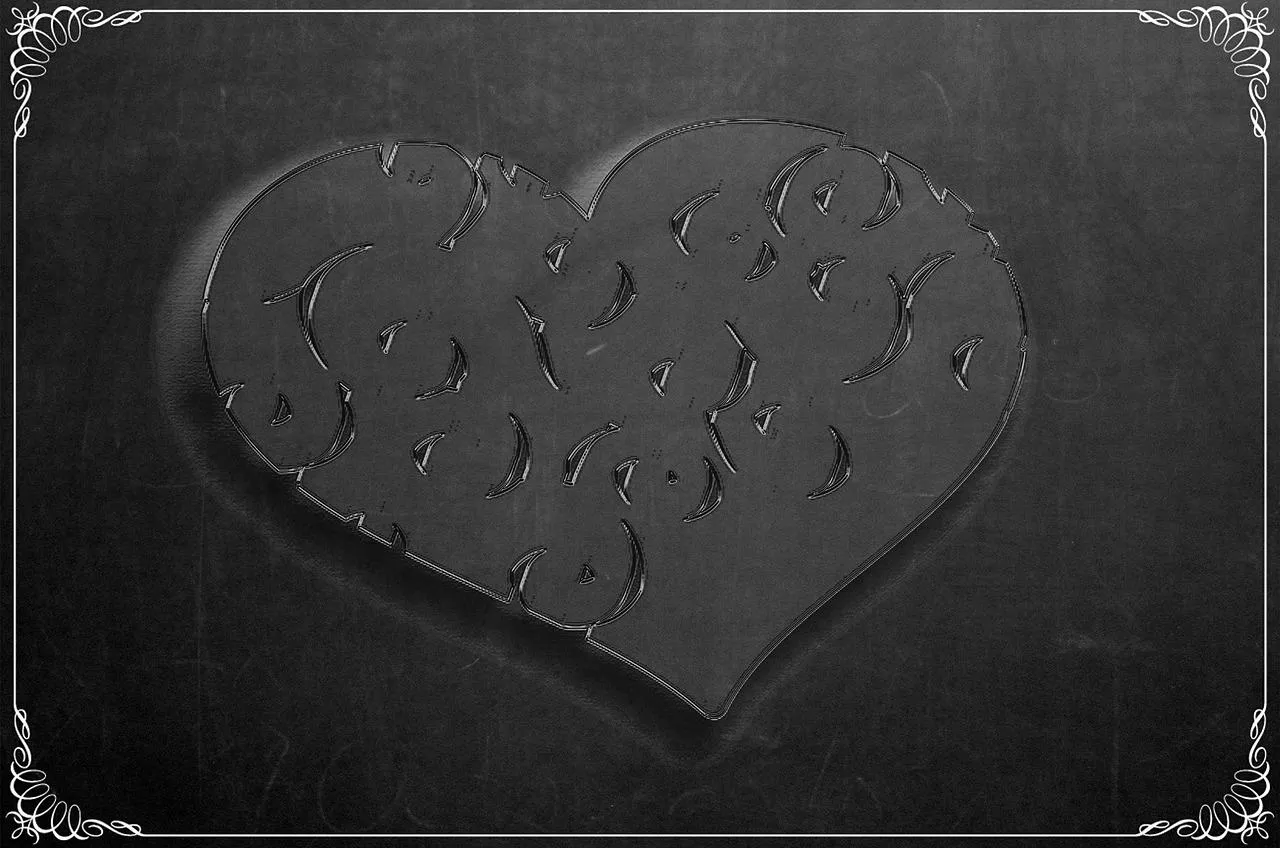 Stone Heart Placed on Sand Showing Timeless Love Wallpaper