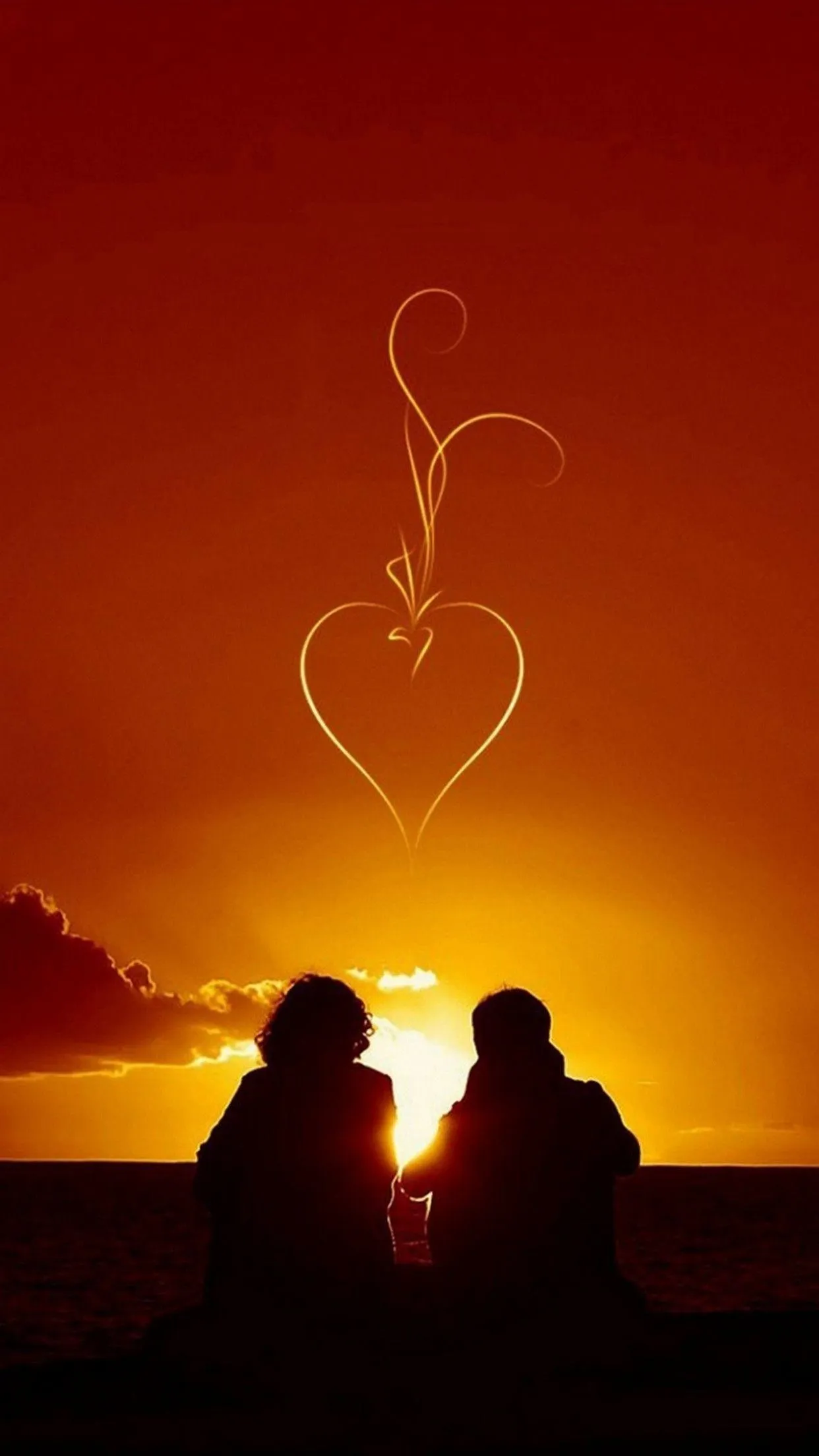 Sunset Silhouette Couple Framed by Golden Heart Light