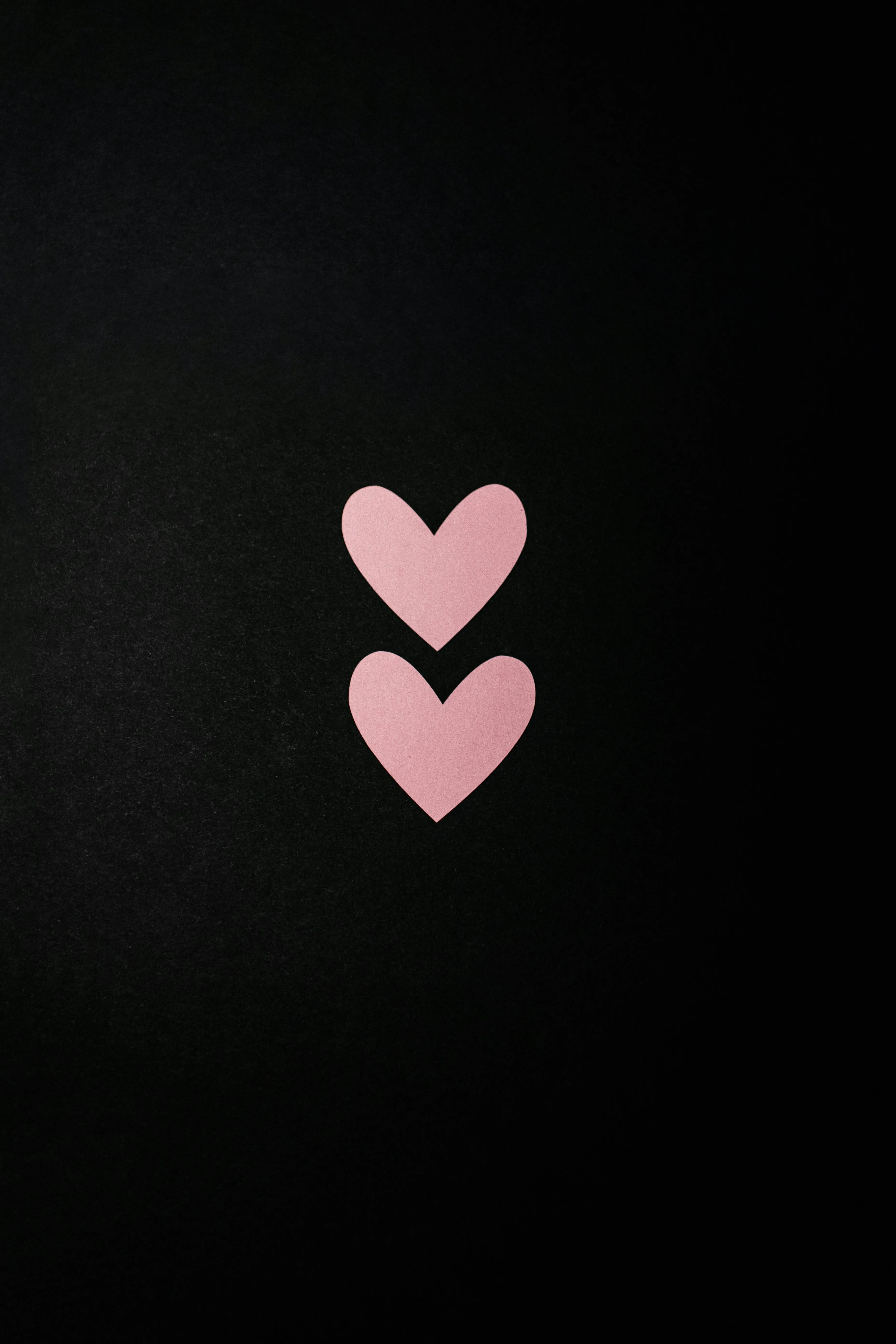 Two Pink Hearts on Black Background Minimal Wallpaper