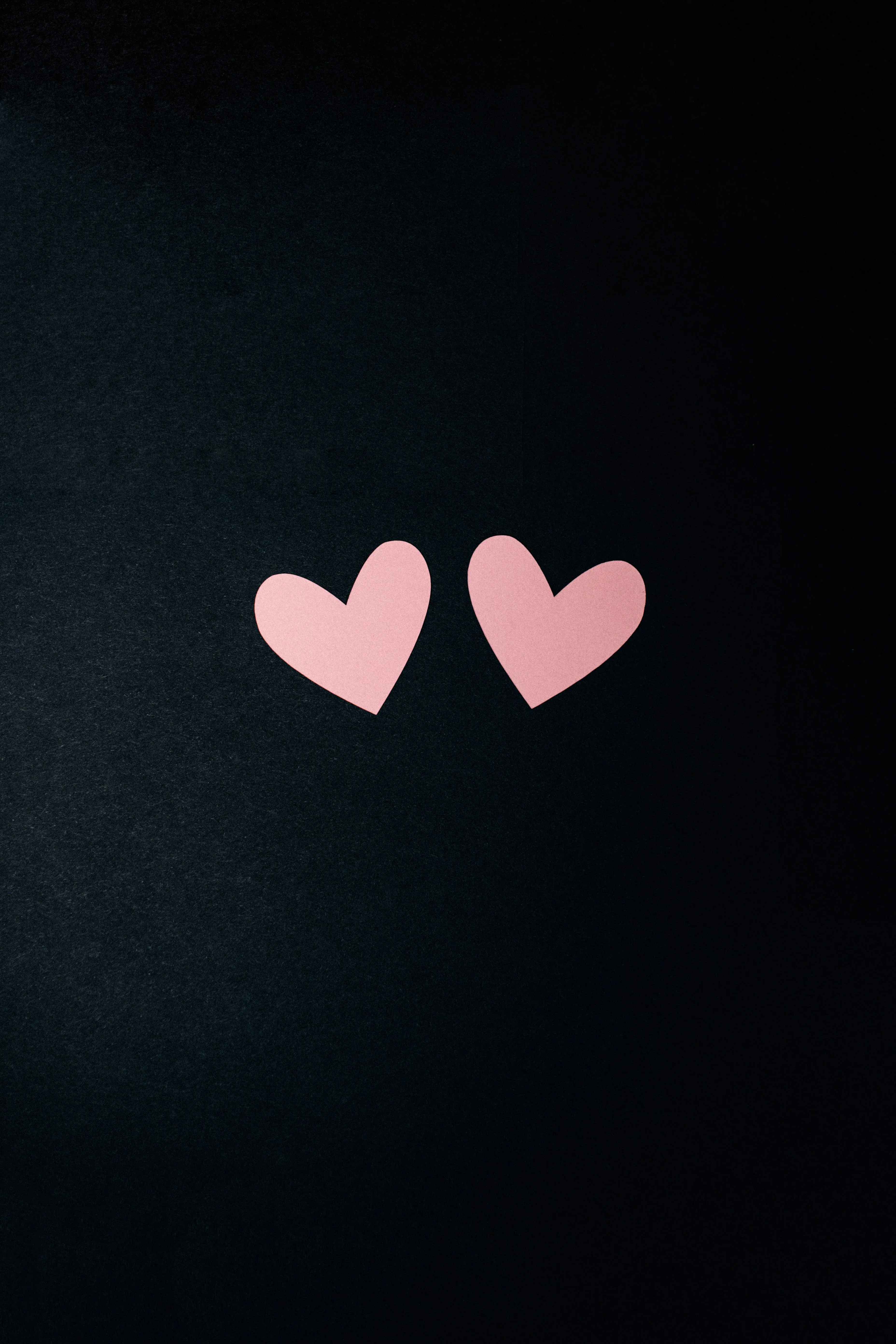 Two Pink Hearts on Black Background of Affection Wallpaper