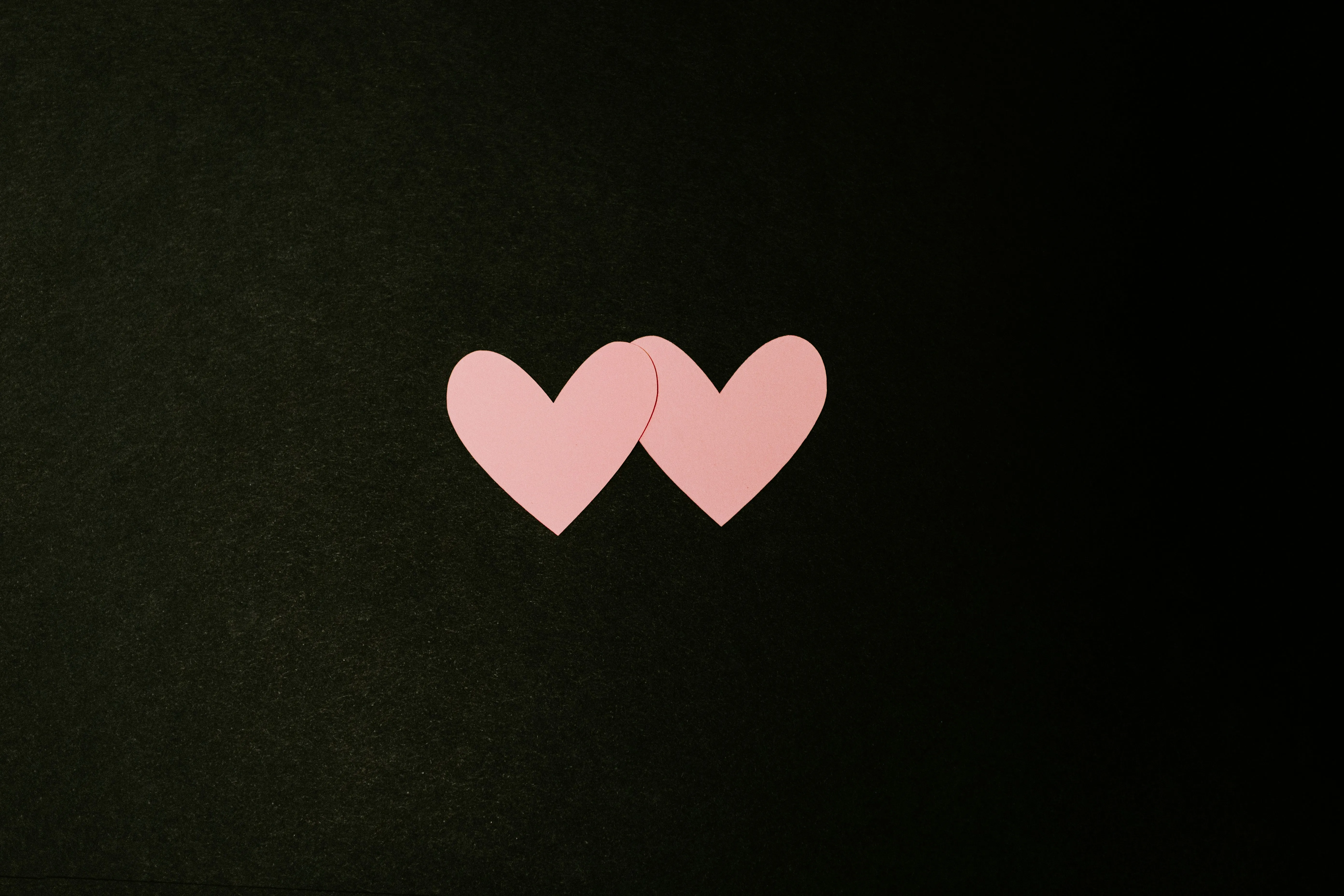 Two Pink Hearts Represent Connection and Affection Wallpaper