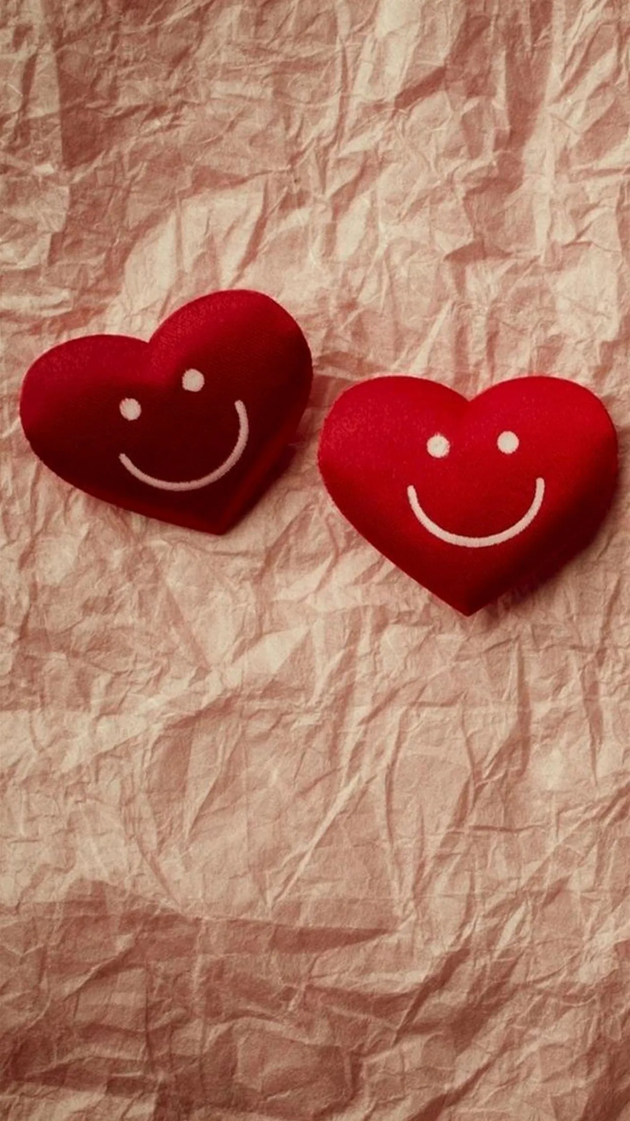 Two Red Smiling Hearts Represent Joyful Romance Wallpaper