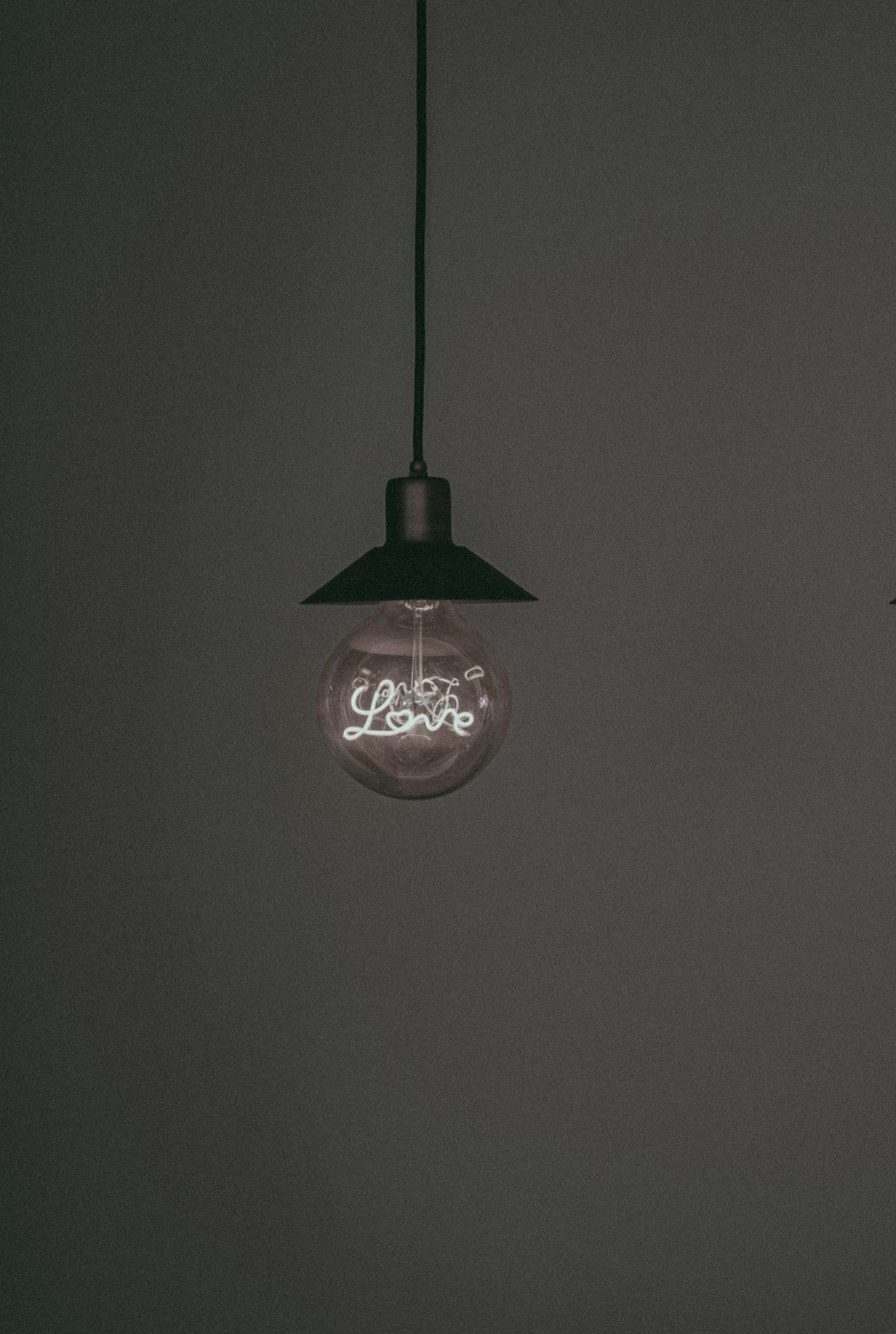 Vintage Hanging Lamp Glowing in Dark Room Wallpaper