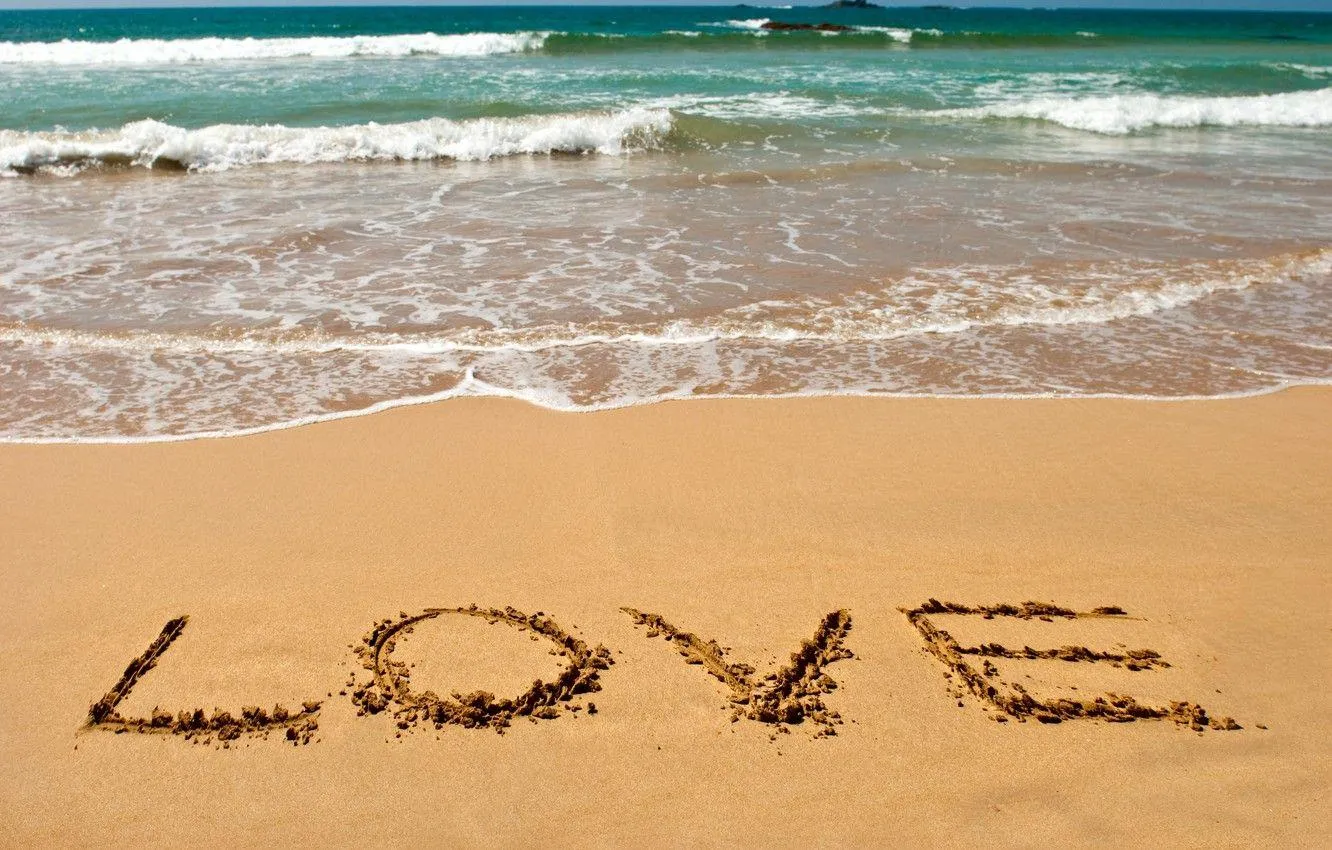 Wallpaper of Love Written on Sand by the Ocean Waves