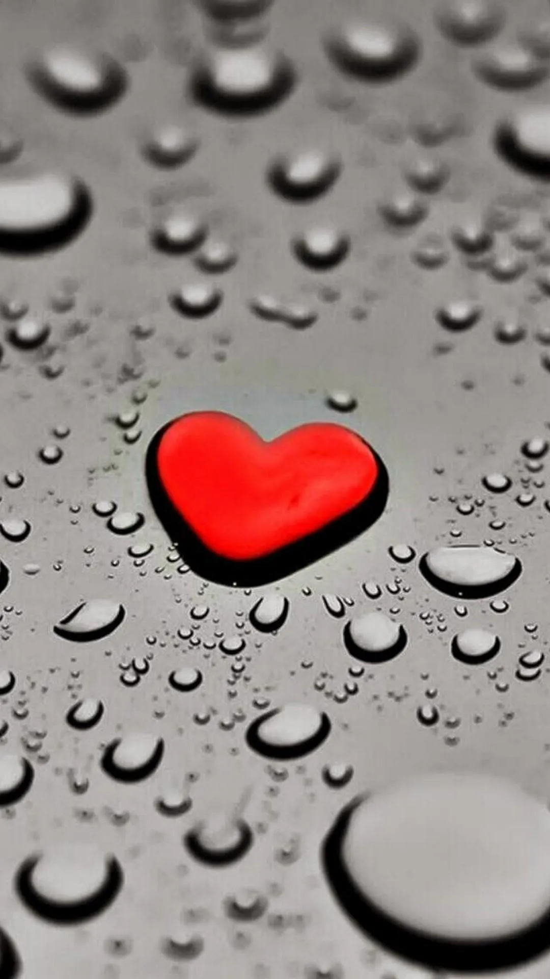 Wallpaper of Red Heart on Raindrop Glass Deep Emotion