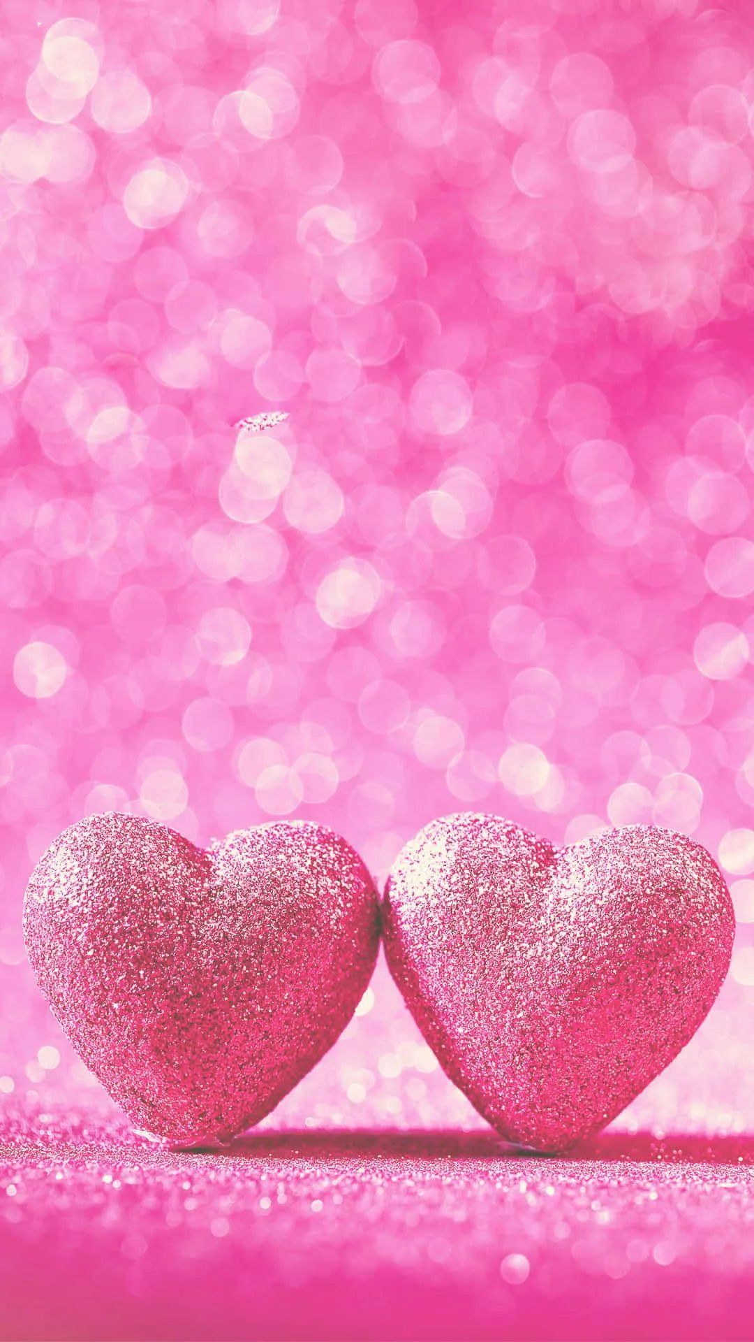 Wallpaper of Two Hearts on Pink Surface Showing Togetherness