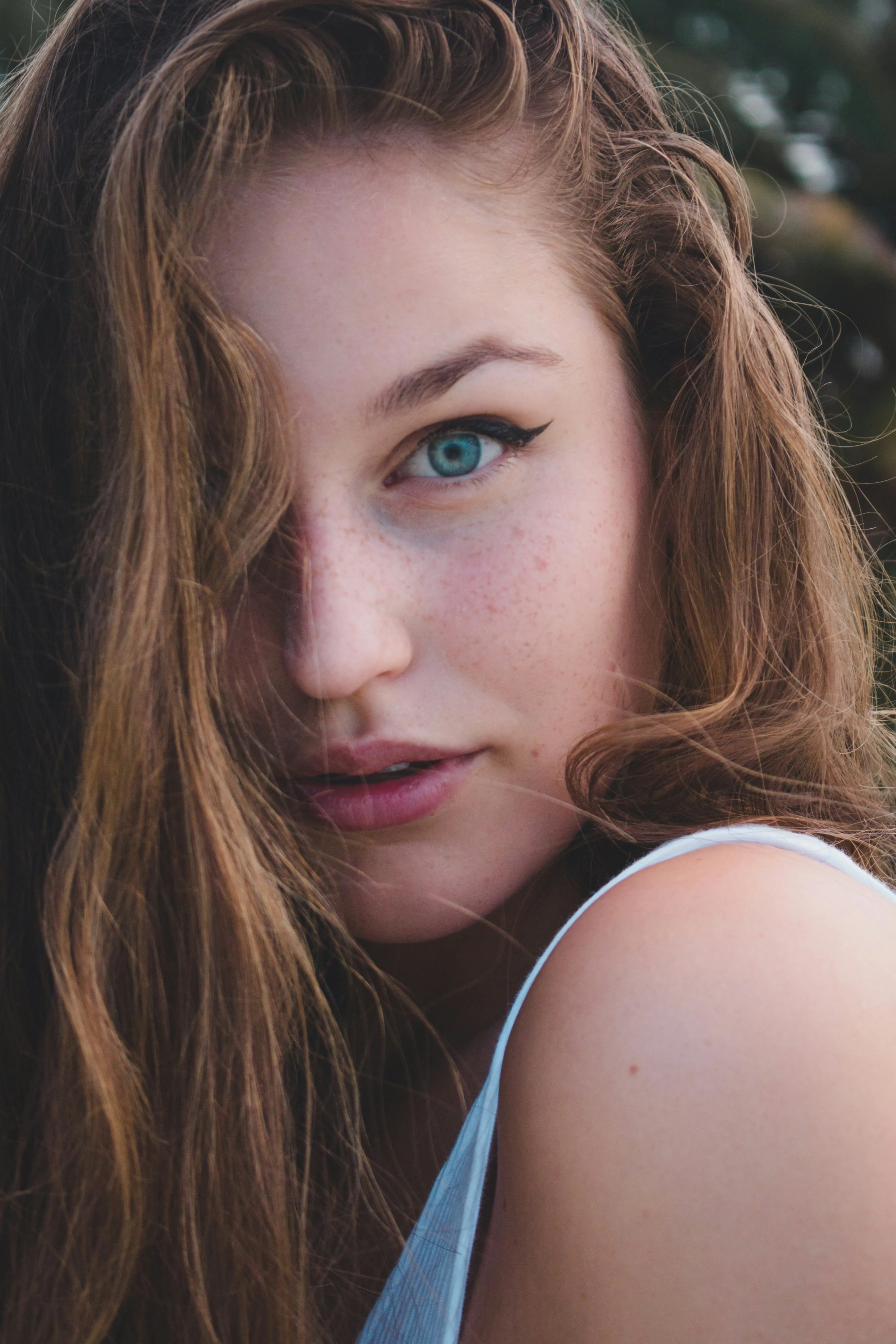 Woman Gazing Calmly Reflecting Beauty and Thought Wallpaper