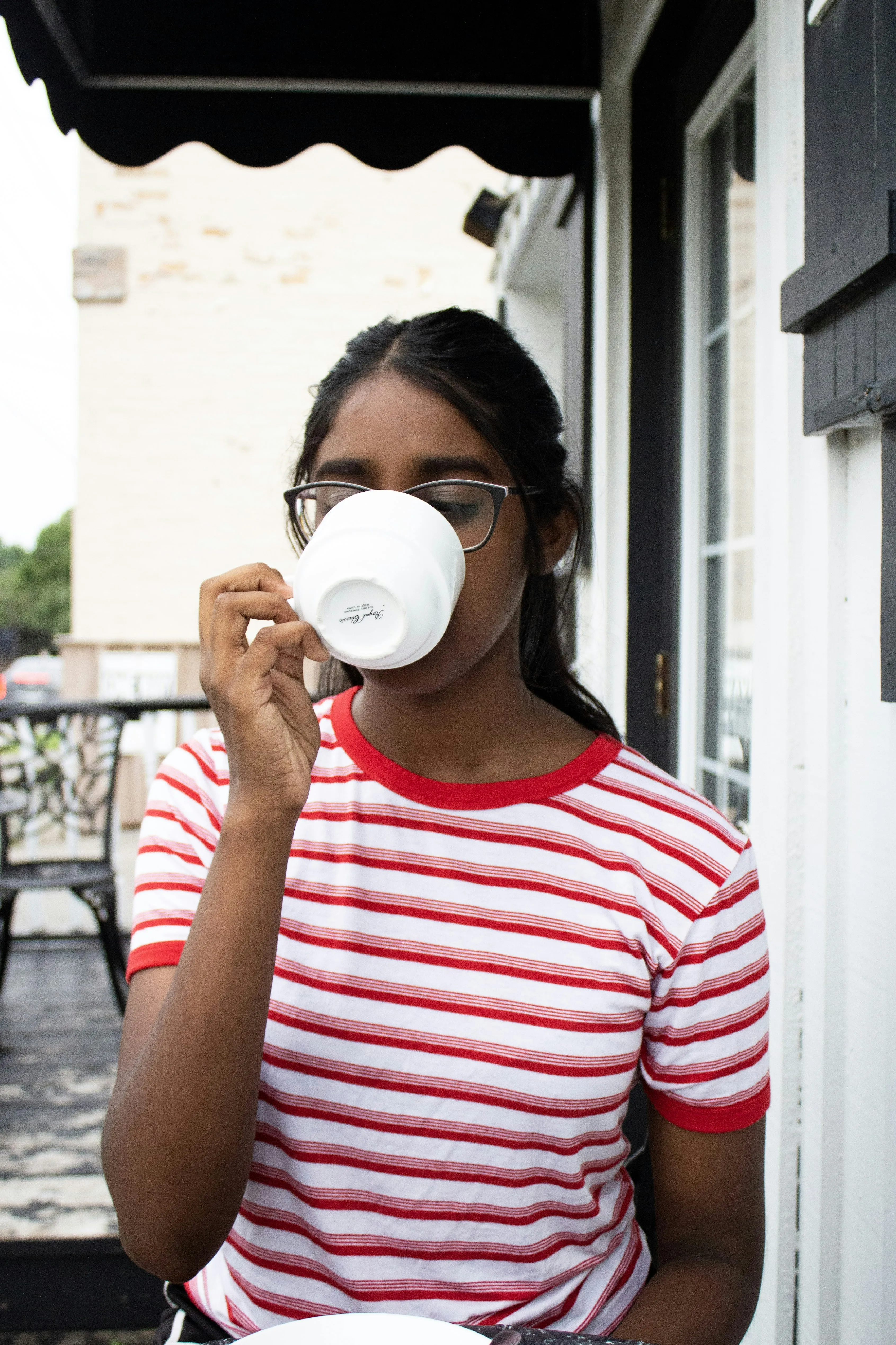 Woman in Striped Shirt Drinking Coffee in Morning Wallpaper