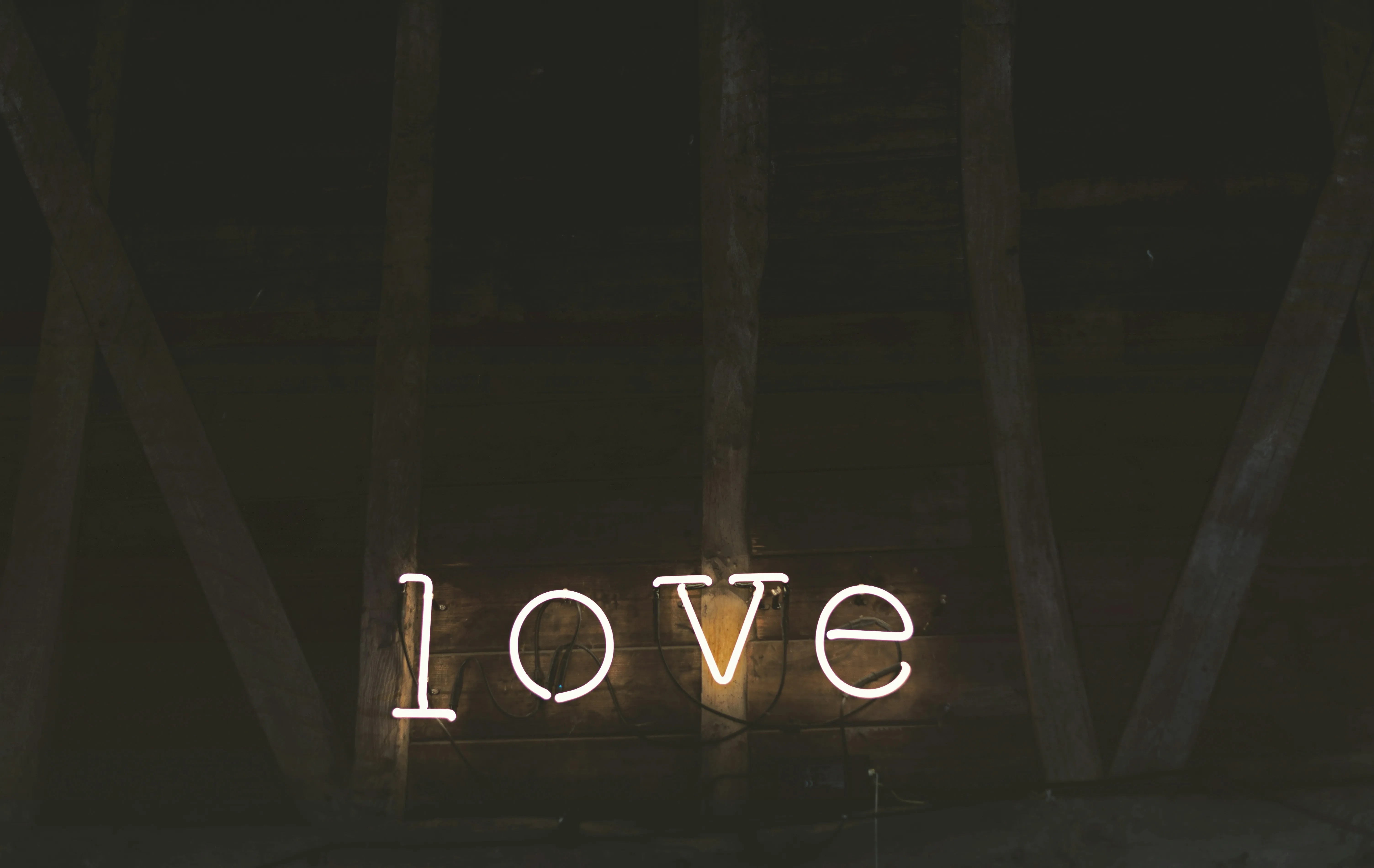 Word Love Illuminated in Dark Romantic Ambience Wallpaper