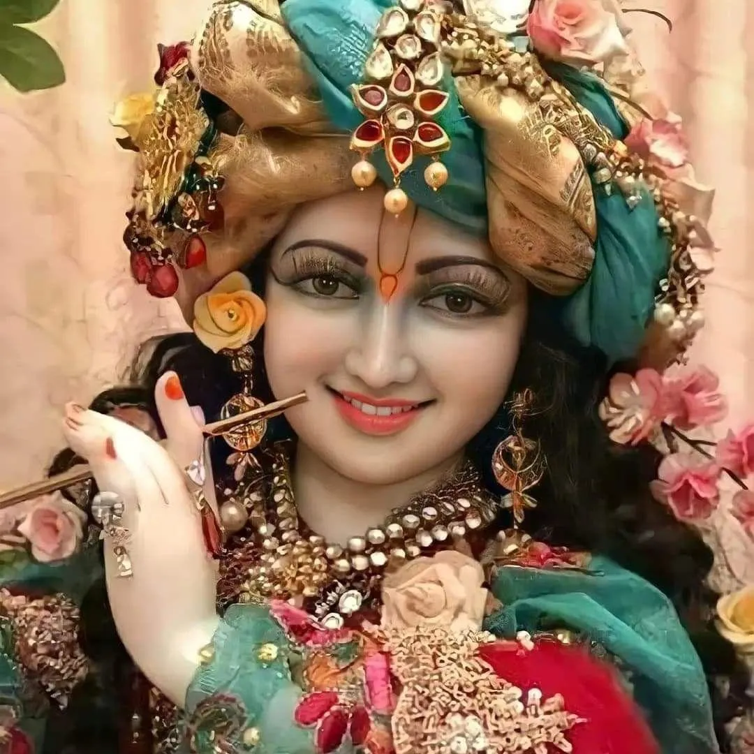 Beautiful Smiling Radha Portrait Adorned with Flowers Wallpaper