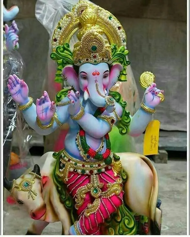 Colorful Ganesh Idol with Mouse and Flower Crown Wallpaper