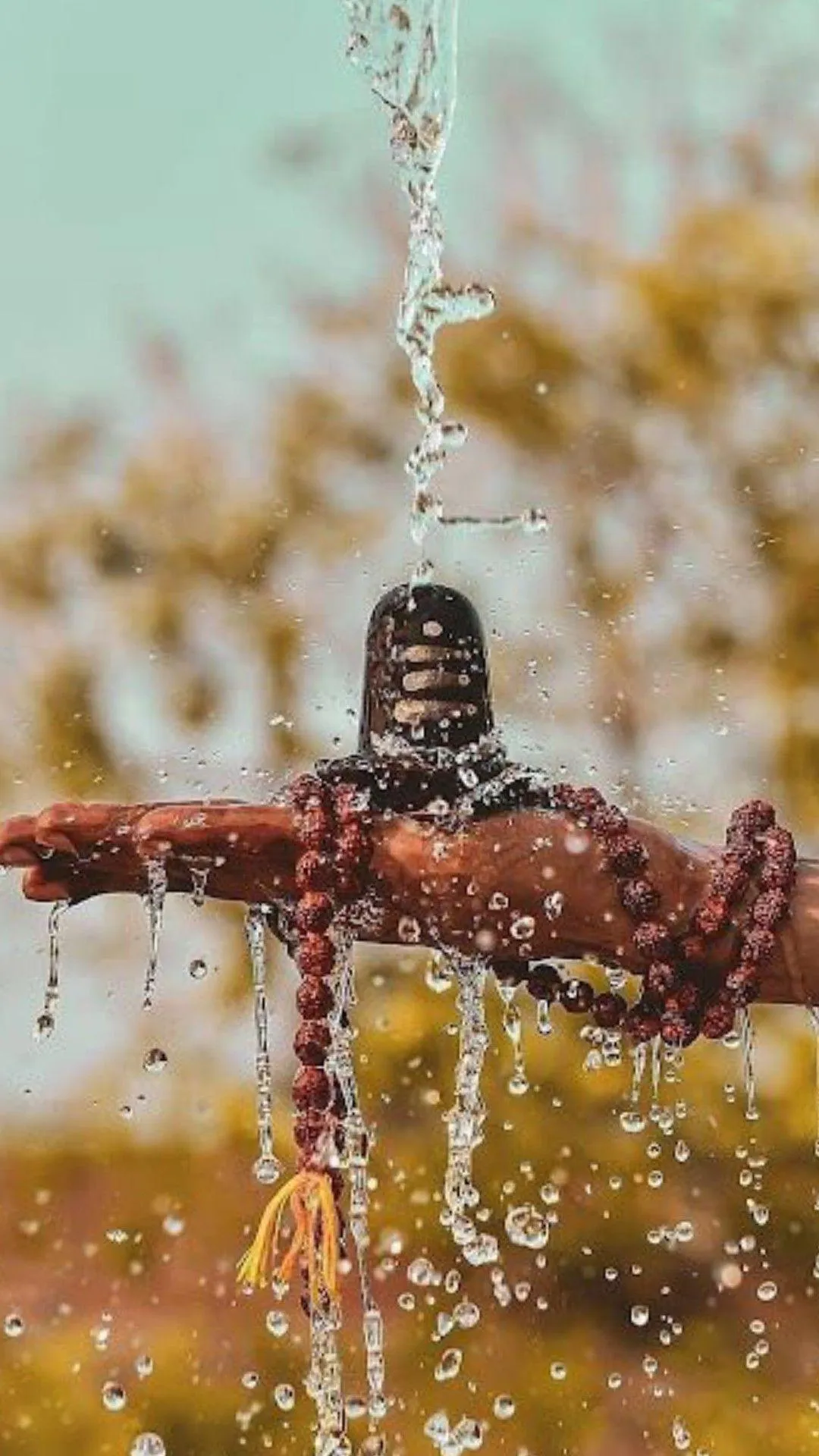 Sacred Shivling with Water Abhishek and Rudraksha Wallpaper