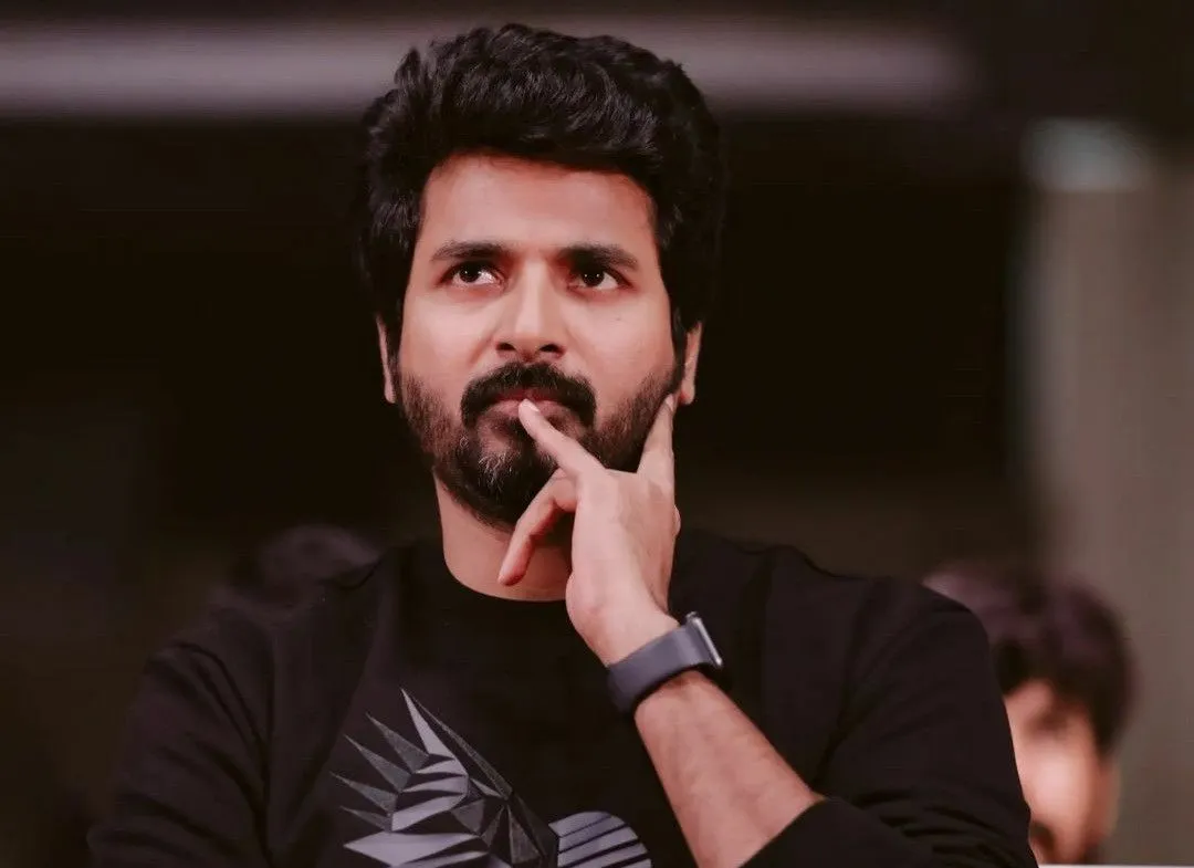 Actor Sivakarthikeyan in Black T Shirt with Hands on Face