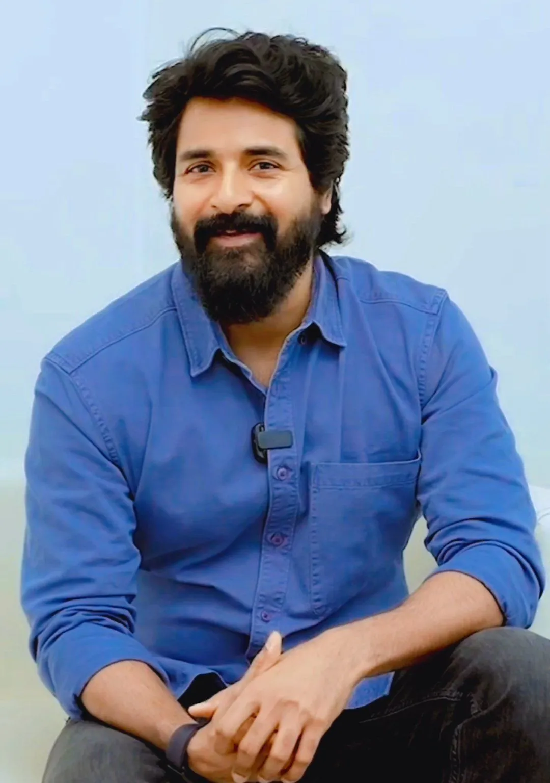 Actor Sivakarthikeyan in Casual Blue Shirt Pose Wallpaper