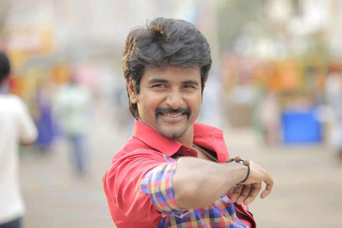 Actor Sivakarthikeyan in Red Shirt with a Blur Background