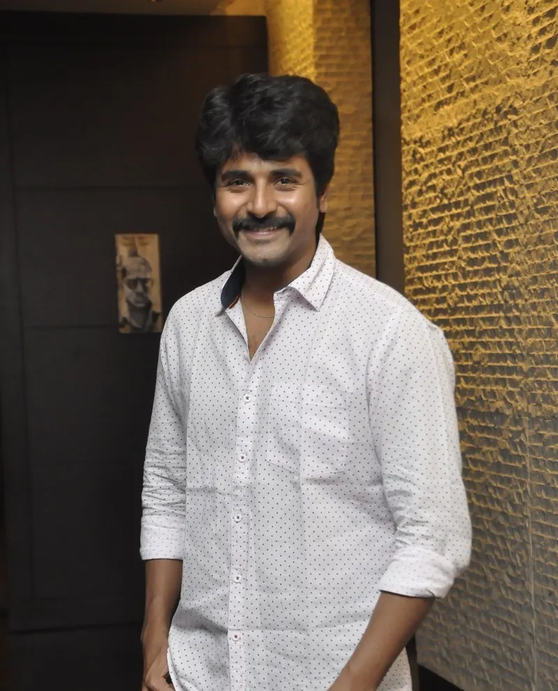 Actor Sivakarthikeyan in White Shirt Smiling Relaxed Image
