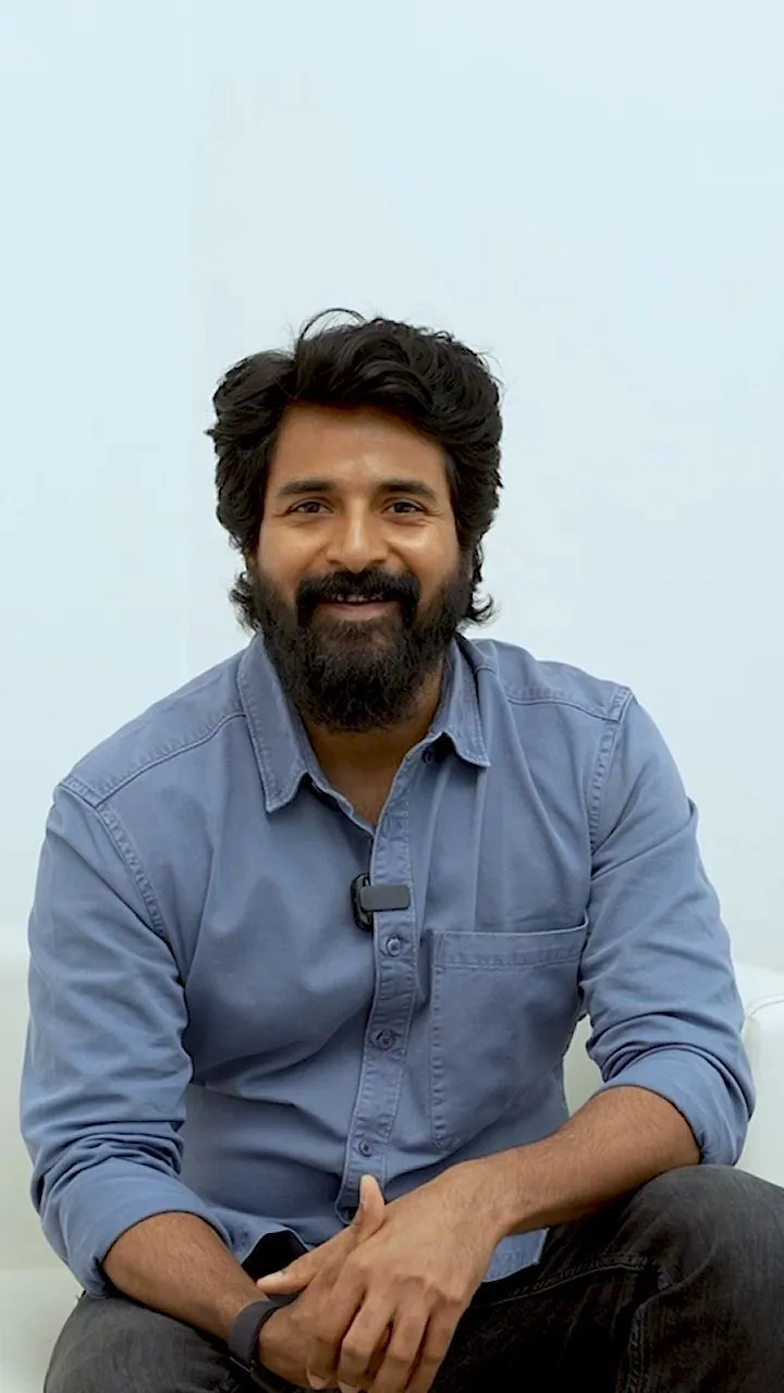 Actor Sivakarthikeyan Relaxed Pose in Blue Shirt Wallpaper