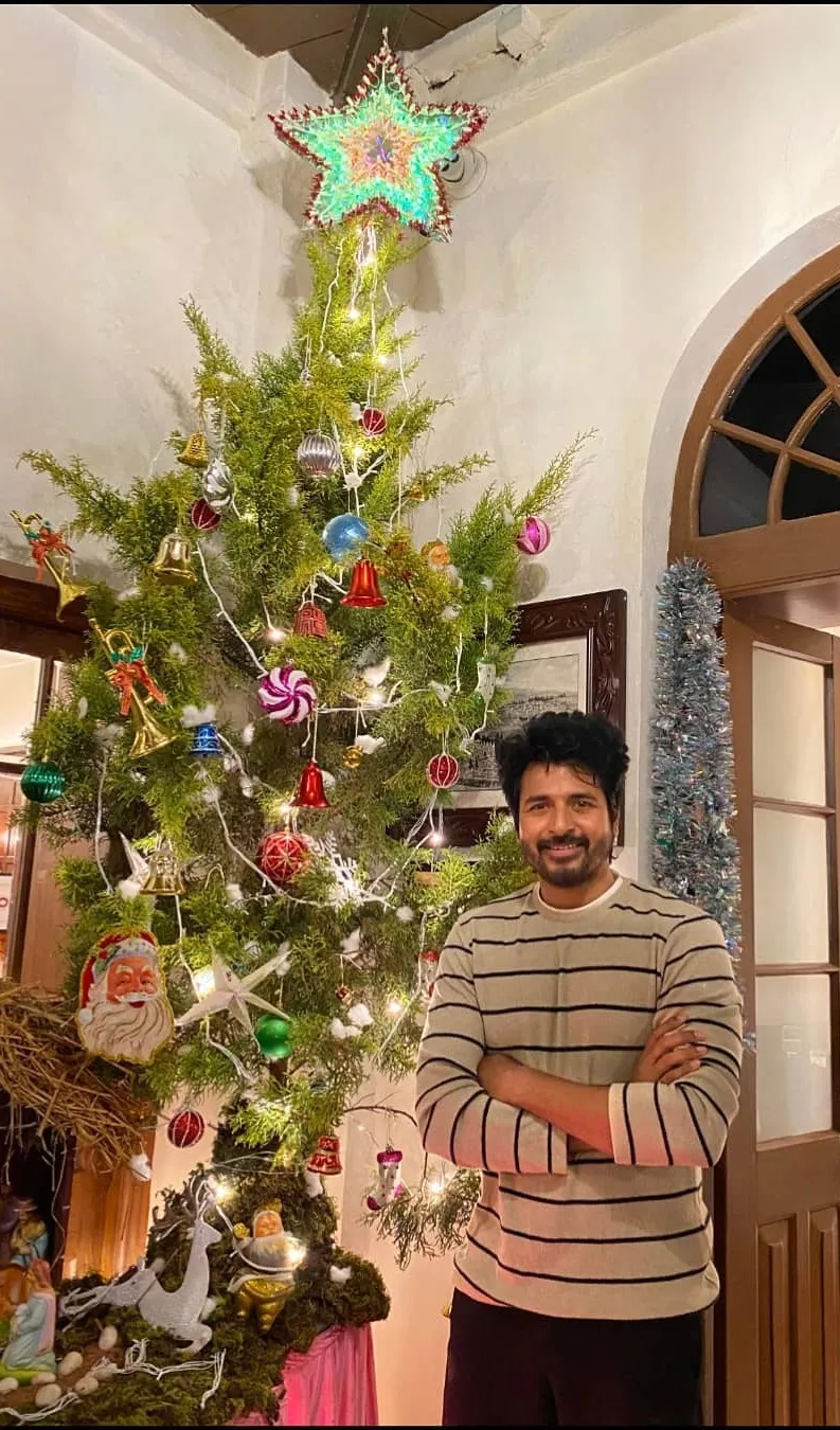 Actor Sivakarthikeyan Standing Near a Christmas Tree Image
