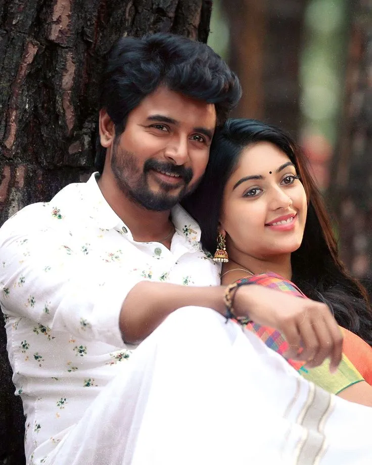 Anu Emmanuel Leaning on Sk Sitting on Tree Roots