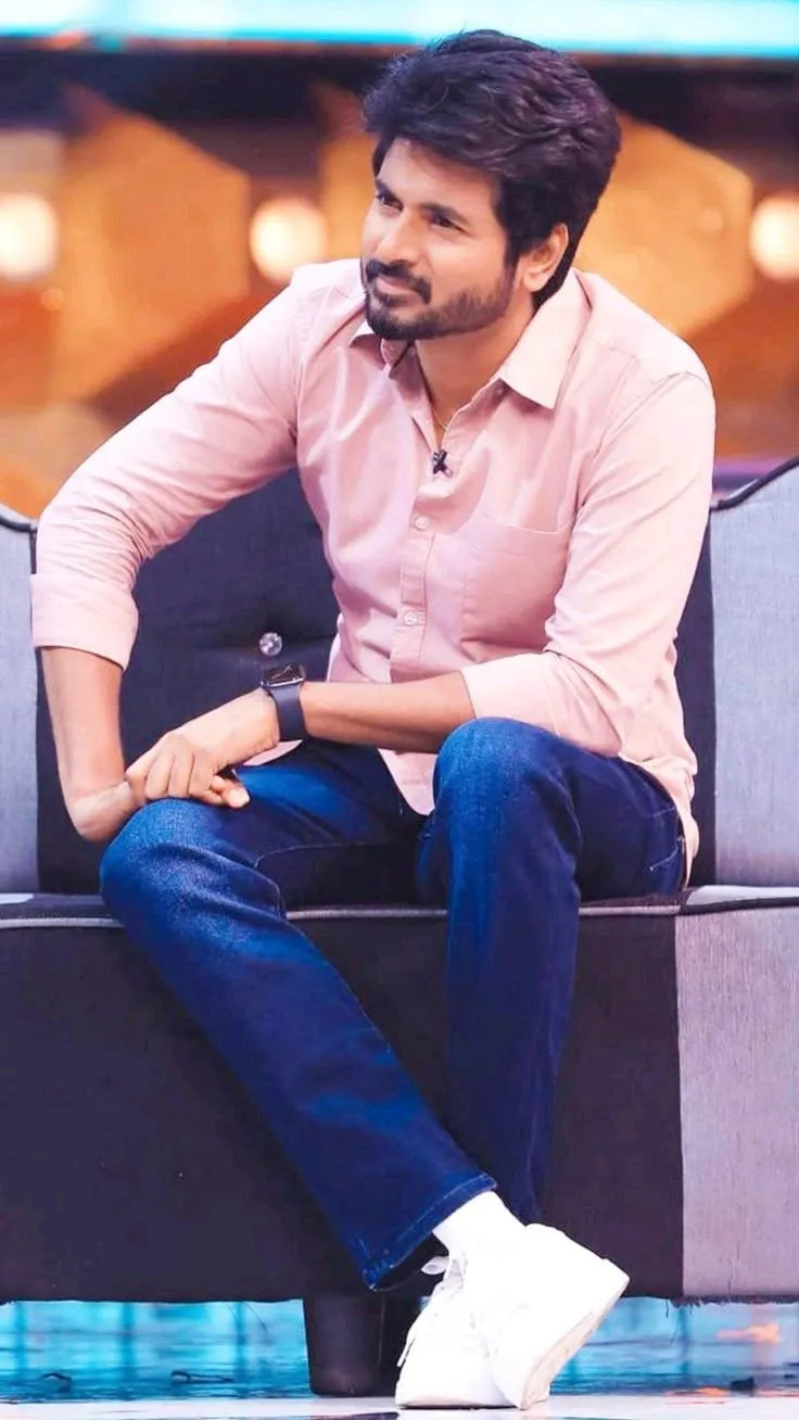 Cute Wallpaper of Sivakarthikeyan Sitting on a Sofa Hd