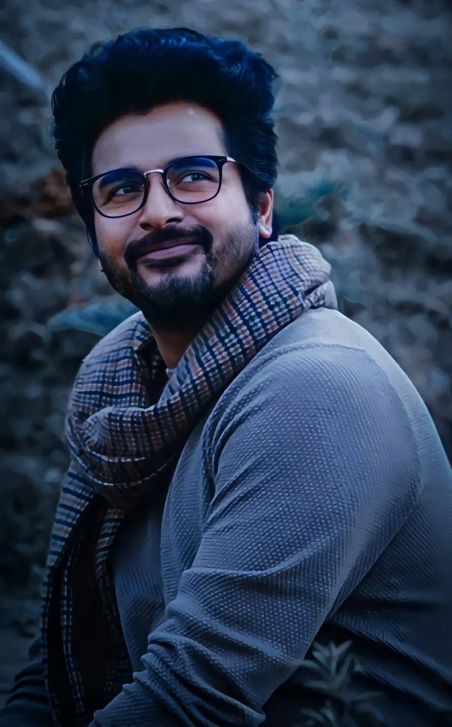 Doctor Movie Still of Sivakarthikeyan Siitting with a Smile