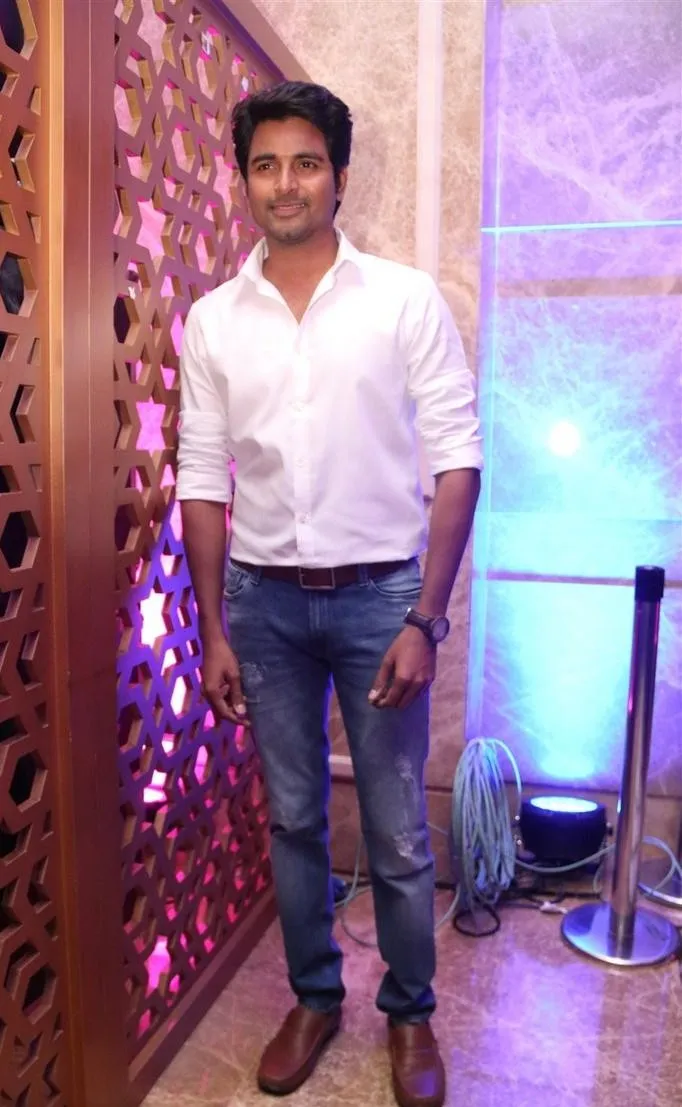 Full Size Image of Sivakarthikeyan Standing on a Wall