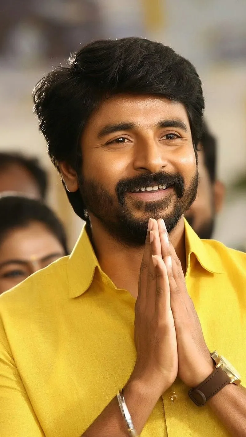 Greeting Pose of Sivakarthikeyan in Yellow Shirt Wallpaper