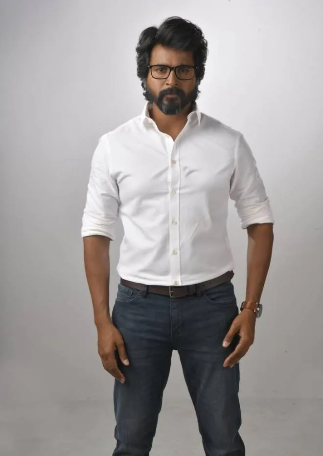 Kanaa Movie Sivakarthikeyan in White Shirt and Gray Jeans