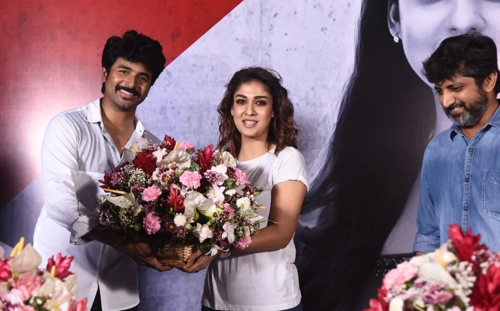 Sivakarthikeyan and Nayanthara Posing with Bouquets At Event