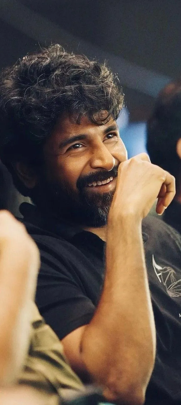 Sivakarthikeyan Candid Laugh Pose in Dimly Lit Area Image
