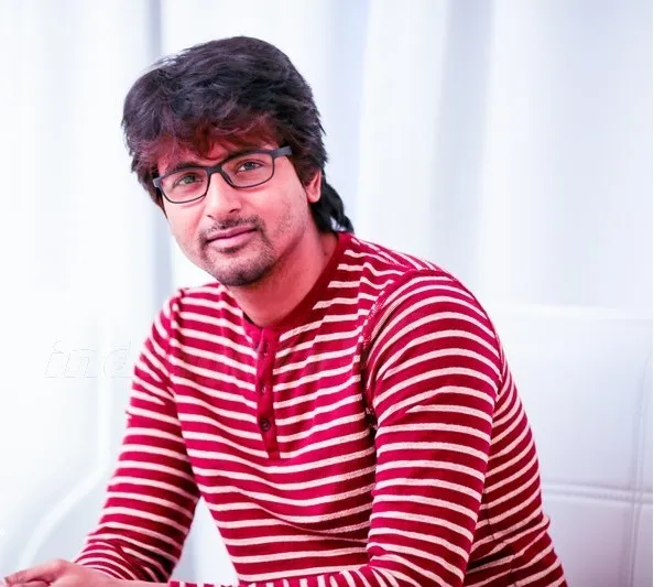 Sivakarthikeyan Casual Red Striped Sweater Sitting Look