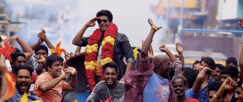 Sivakarthikeyan Celebrating with a Crowd Scene from Remo